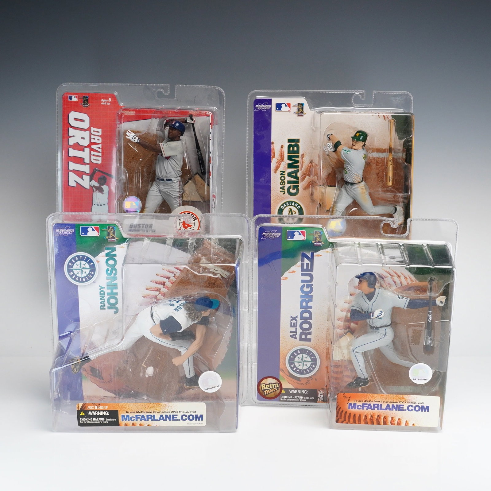 4pc Collection of McFarlane Toys MLB Sports Picks Series Action Figures: A collection of four McFarlane Toys MLB Sports Picks collectible action figures featuring prominent Major League Baseball players. The group includes David Ortiz in a Boston Red Sox home white uniform