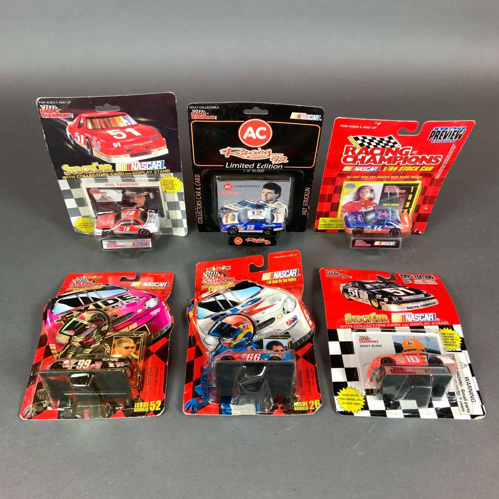 Six Racing Champions NASCAR Collectible Die-Cast Car Models: This collection consists of six NASCAR collectible car models produced by Racing Champions in 1/64 scale. Each die-cast stock car remains sealed in its original blister pack packaging. The group featu