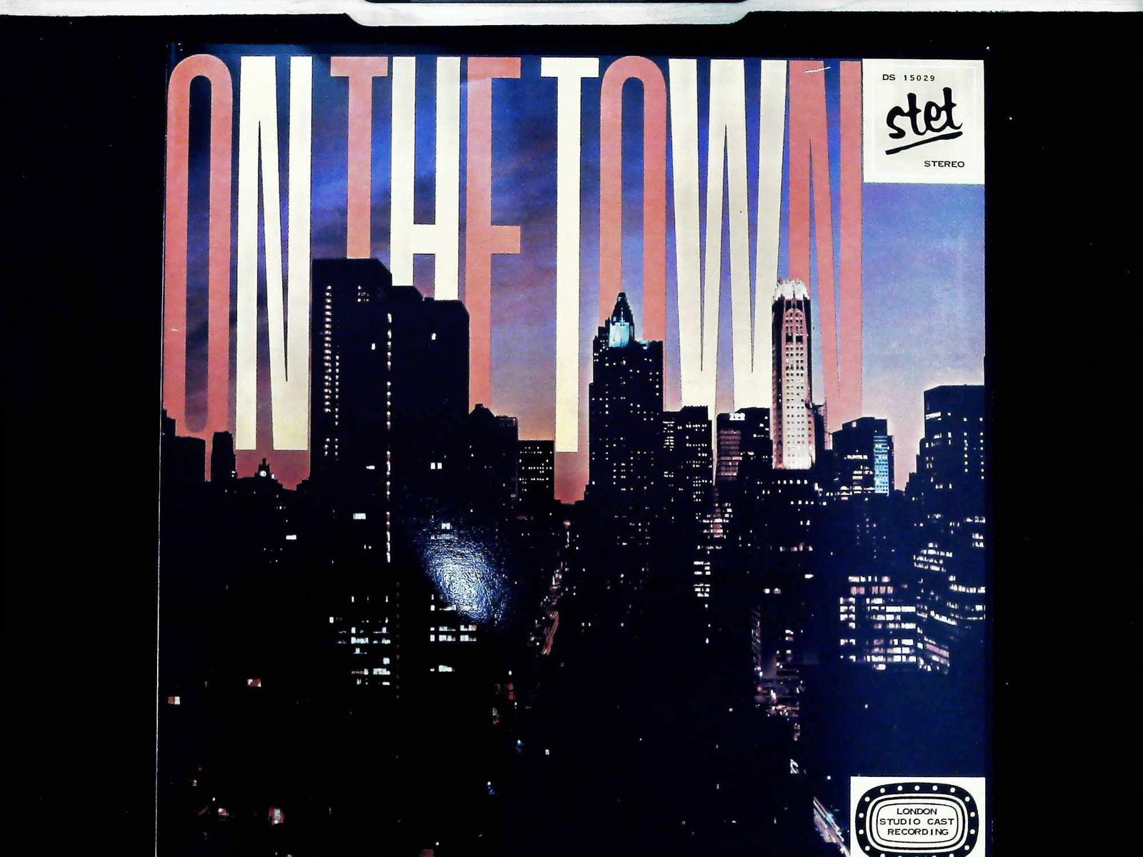 On The Town London Studio Cast Recording Stet Records Vinyl LP DS 15029: This 12-inch stereo long-play vinyl record features a London studio cast recreation of the score from the MGM/Arthur Freed film On The Town. The production features music by Leonard Bernstein and Roge