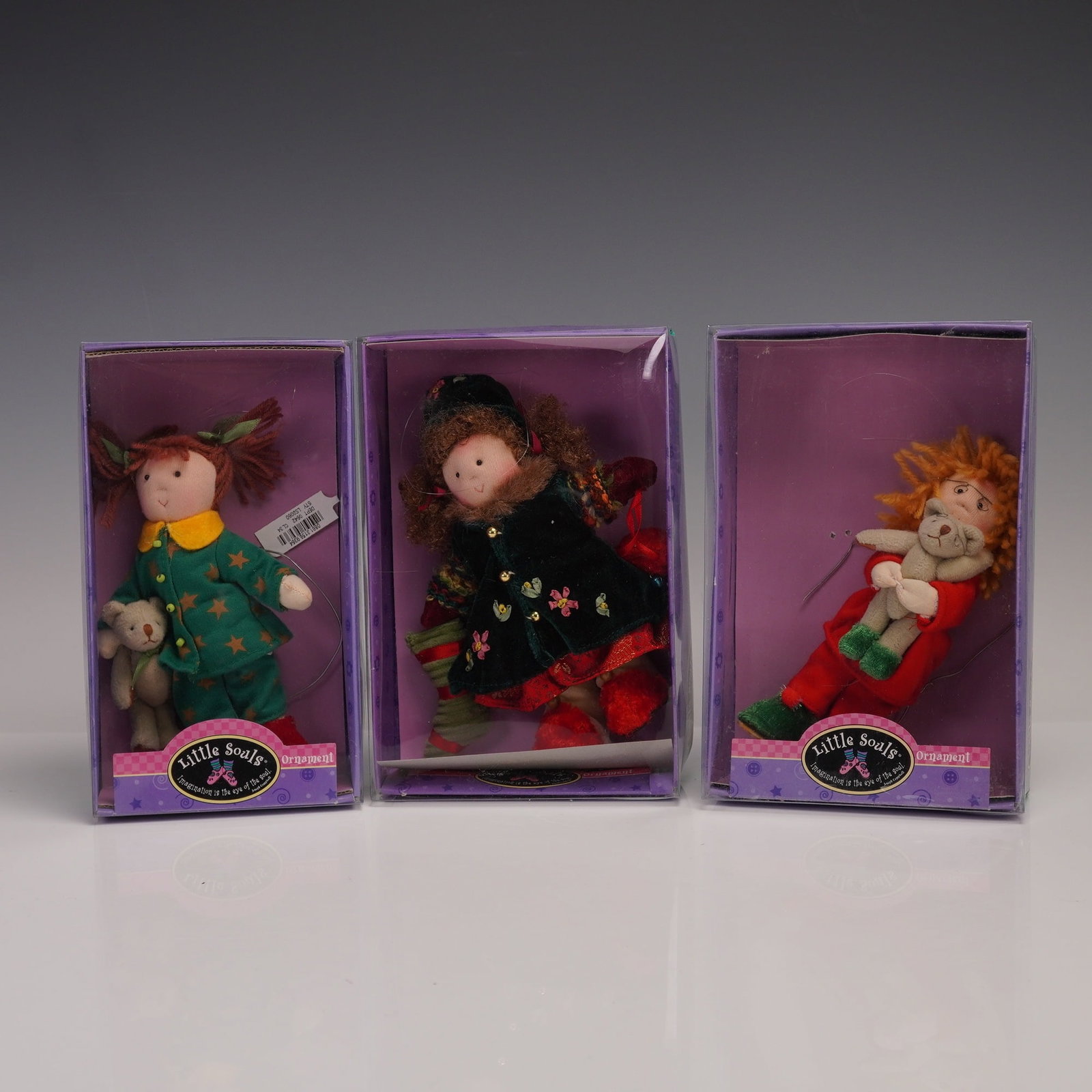 3pc Kurt S. Adler Little Souls Cloth Holiday Ornaments: Charming set of three Little Souls cloth holiday ornaments by Kurt S. Adler. Each ornament features a soft-bodied childlike figure in festive attire, with whimsical details including plush teddy