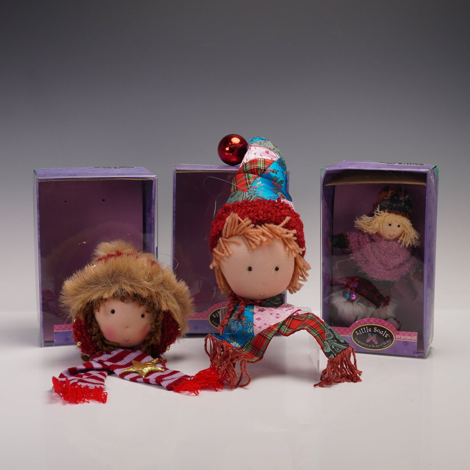 3pc Kurt S. Adler Little Souls Cloth Holiday Ornaments: Delightful group of three cloth holiday ornaments from the Little Souls collection by Kurt S. Adler. Each ornament depicts a whimsical child figure with expressive features and playful details,