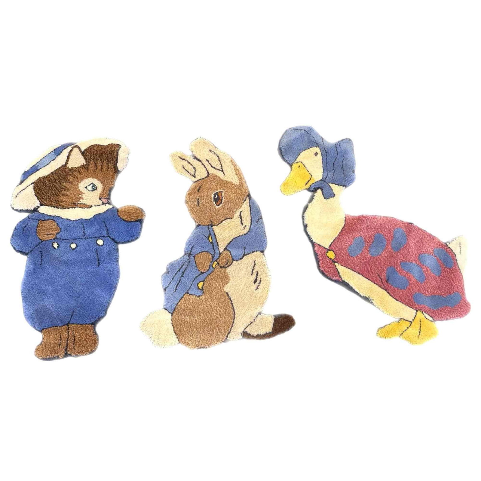 3pc Joy Tuft Design Beatrix Potter Licensed Wool Nursery Rugs, 1980: A set of three hand-tufted character rugs featuring illustrations by Beatrix Potter. The collection consists of Peter Rabbit in his iconic blue jacket, Jemima Puddle-Duck in her bonnet and red shawl, 