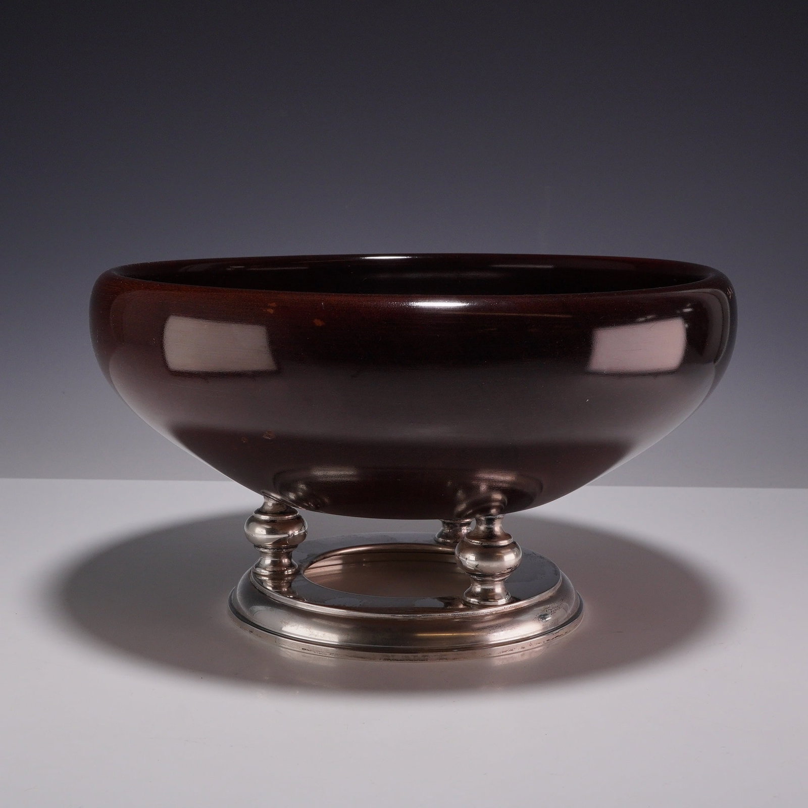 Hallmark Silversmiths Mid-Century Mahogany and Sterling Silver Footed Salad Bowl: This mid-century modern pedestal salad bowl is a product of Hallmark Silversmiths, New York. The bowl is turned from solid mahogany with a deep, high-gloss polished finish. The vessel is supported by 