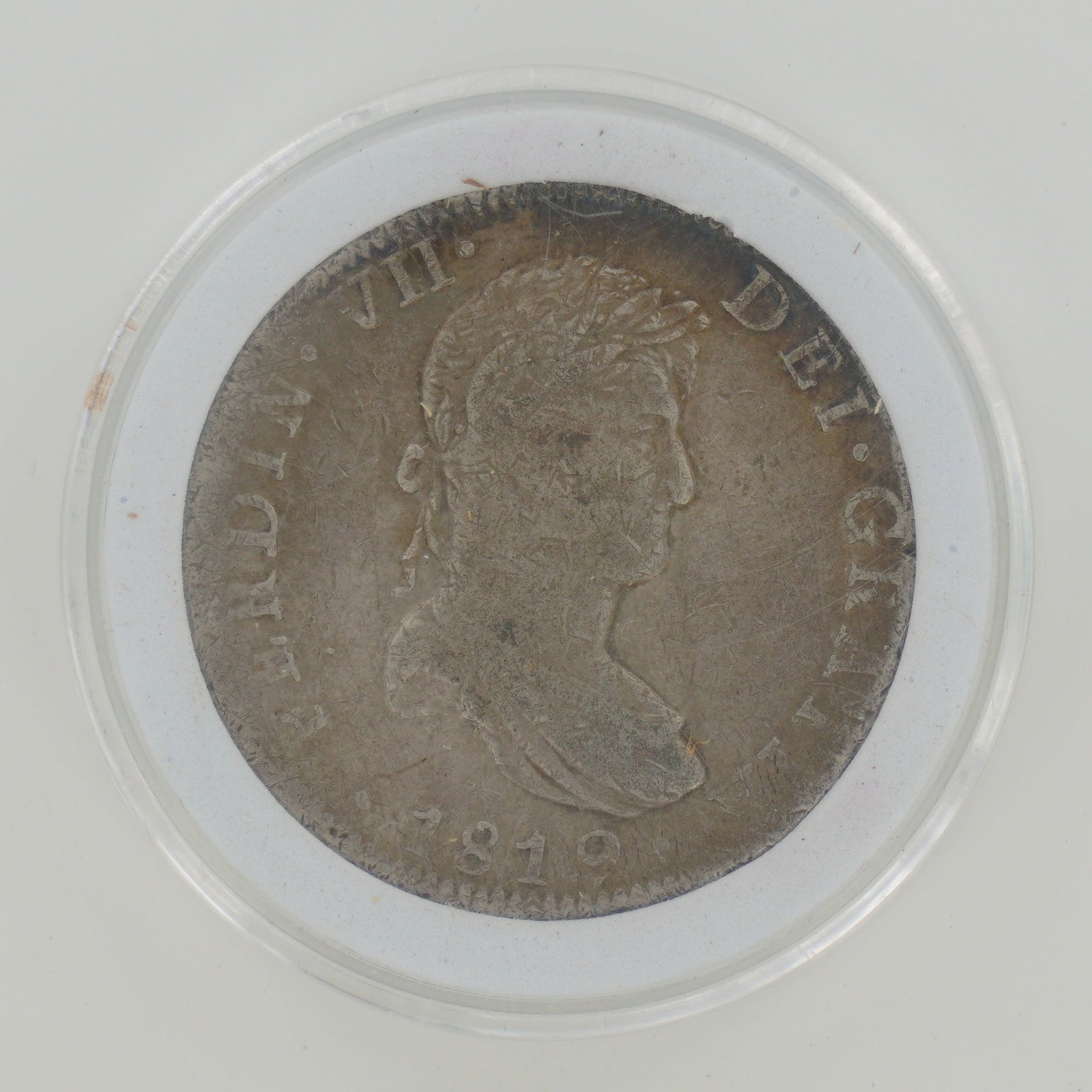 1819 MX Silver 8 Reales, Ferdinand VII, Mexico City Mint: This 1819 Spanish colonial 8 Reales silver coin was struck at the Mexico City Mint during the reign of King Ferdinand VII. The obverse features the laureate and draped bust type with the legend