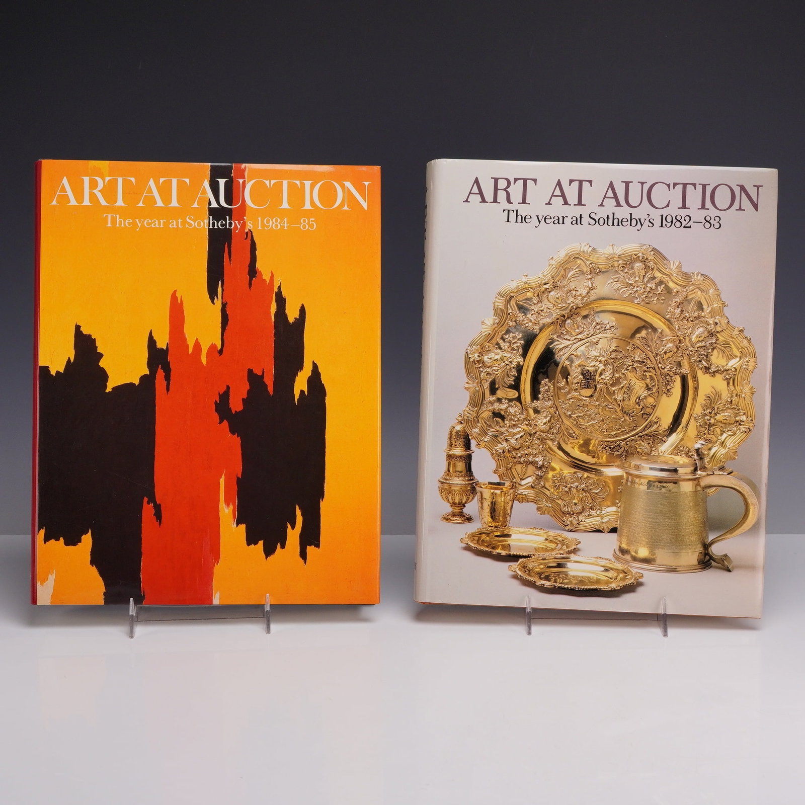 Two Volumes (DJ). Ayers, Tim and Georgia Fogg, Eds. Art at Auction: The Year at Sotheby's 1982-83: This grouping of Sotheby's art auction books includes the annual reviews for the 1982-83 and 1984-85 seasons. These large quarto-format volumes serve as a definitive record of the international art ma