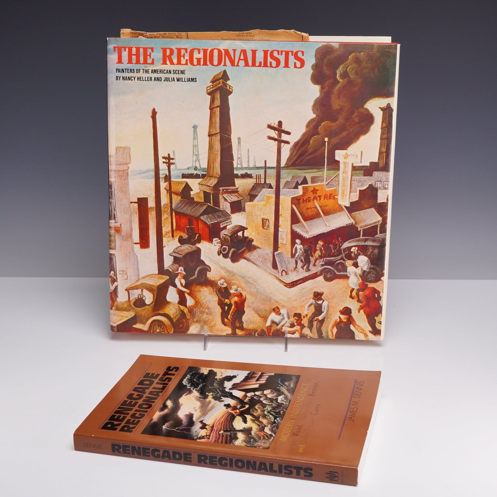 2pc American Regionalist Art Books, 1976-1998: This lot consists of tqo Art Books focusing on the American Regionalist movement, including one hardcover and one trade paperback volume. The first item is a hardcover edition of The Regionalists: Pai