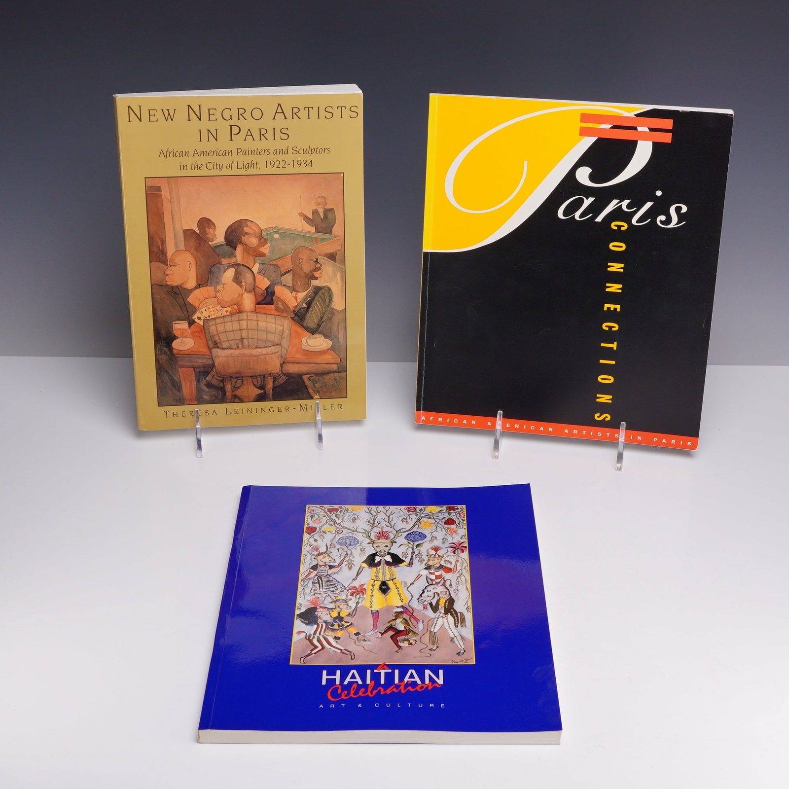 3pc Volumes: African-American and Caribbean Art and French Connections: A lot of three volumes exploring themes of African-American and Caribbean art with French connections. The collection includes one hardcover monograph and two softcover exhibition catalogues. The