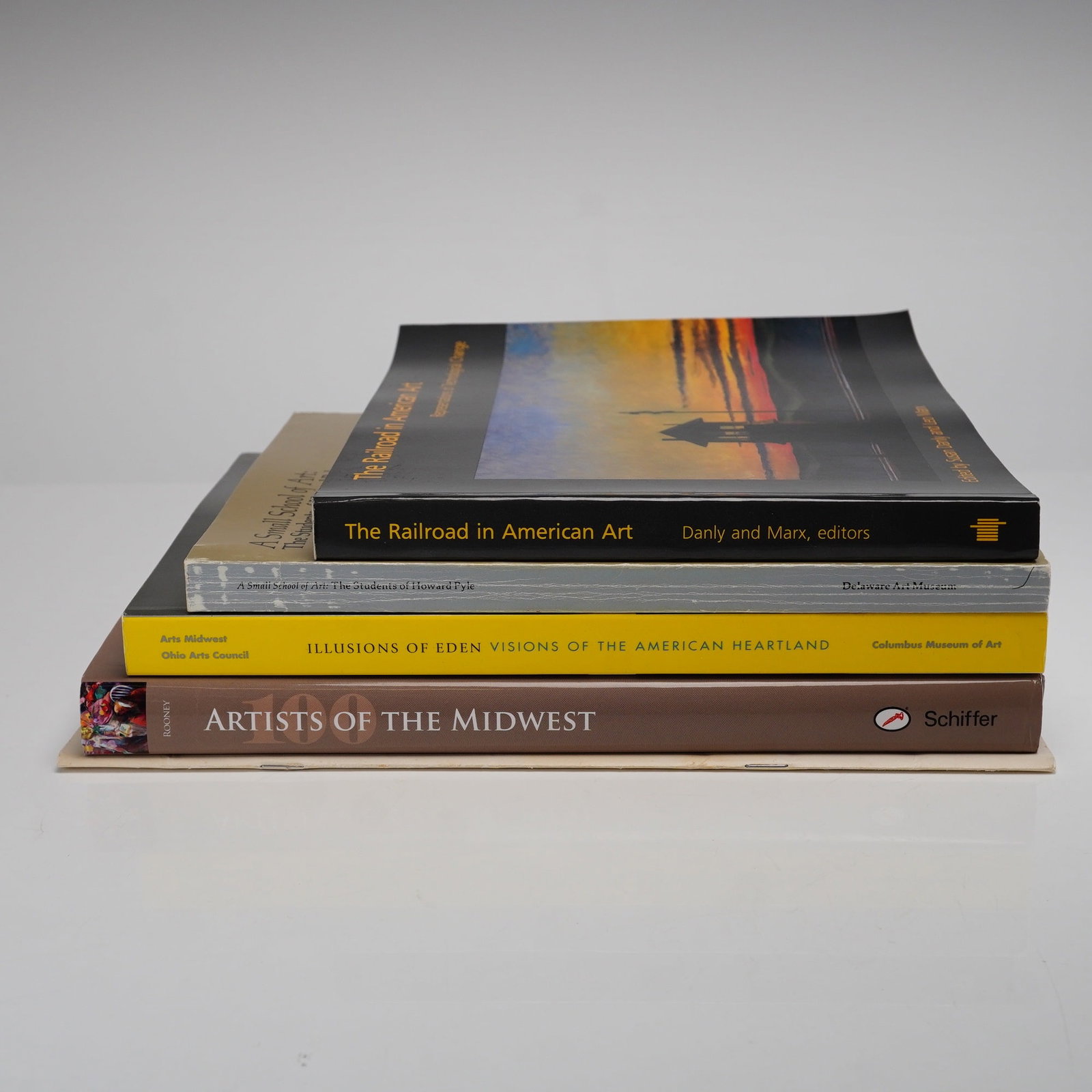 5pc American Art Books and Exhibition Catalogs: A collection of five art books and exhibition catalogs focused on American regionalism and art history. The group includes one hardcover volume: 100 Artists of the Midwest: Illinois, Indiana, Michigan