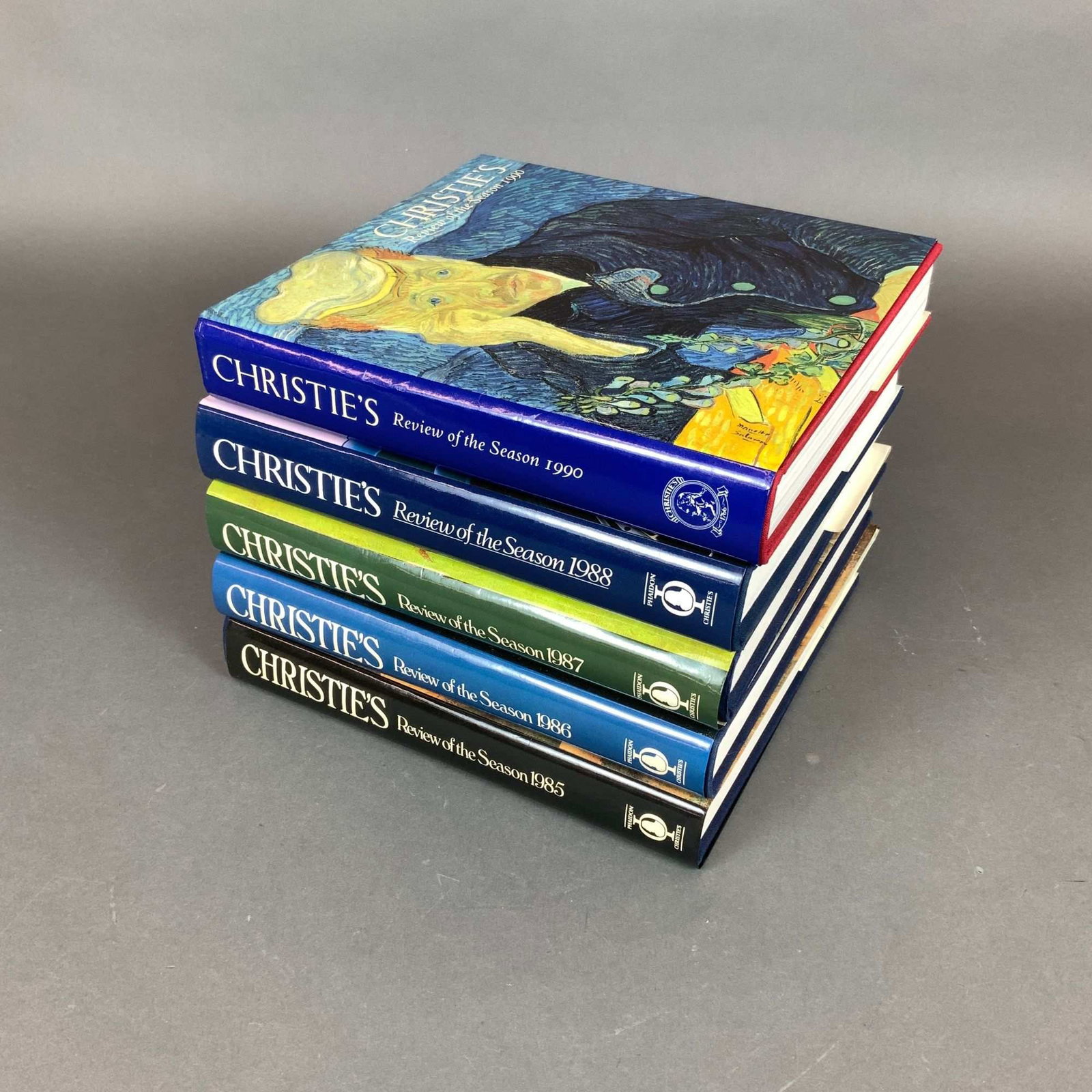 5pc Volumes of Christie's Review of the Season, 1985-1990: This lot features a collection of 5 vintage volumes of Christie's Review of the Season, specifically for the years 1985, 1986, 1987, 1988, and 1990. Published by Phaidon Press in association with