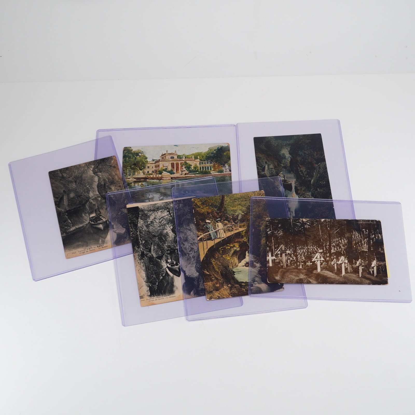 6pc Vintage Postcards featuring France and Poland: This lot consists of six vintage European postcards from the early 20th century, including three variations of Environs d'Aix-les-Bains ??" Gorges du Sierroz ??" Le Bateau, depicting a small boat navi