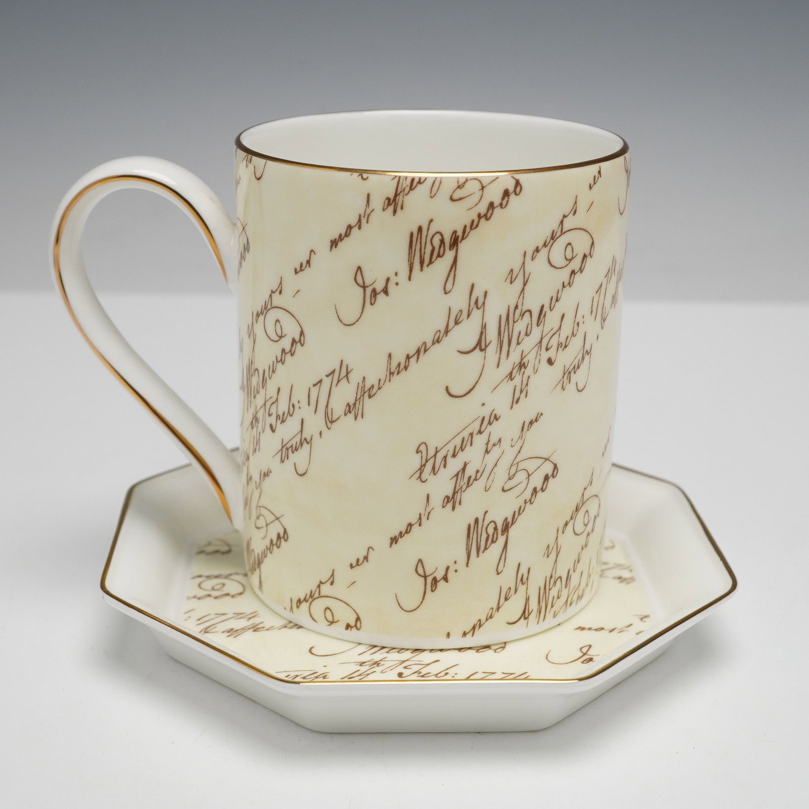 Josiah Wedgwood Bicentenary Cup and Saucer Set, Signed: Bone china cup and octagonal saucer set, each piece with a cream ground decorated in brown script resembling excerpts from historical letters, with gold banding on the rims and the cup handle. Undersi