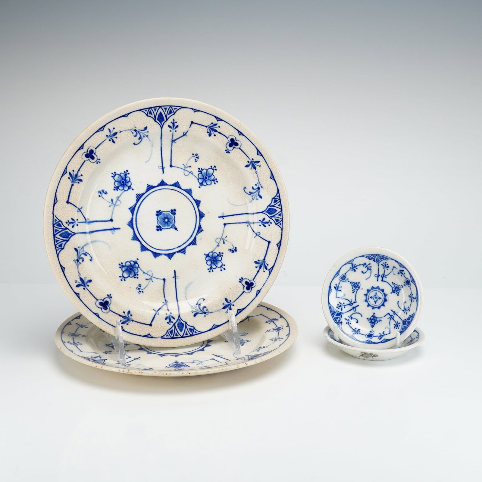 Group of Four Ridgways Royal Semi Porcelain Dishes in the Copenhagen Pattern: This set of four English semi-porcelain or fine earthenware items is produced by Ridgways of Staffordshire in the Copenhagen pattern. The group consists of two large circular plates and two small, dee