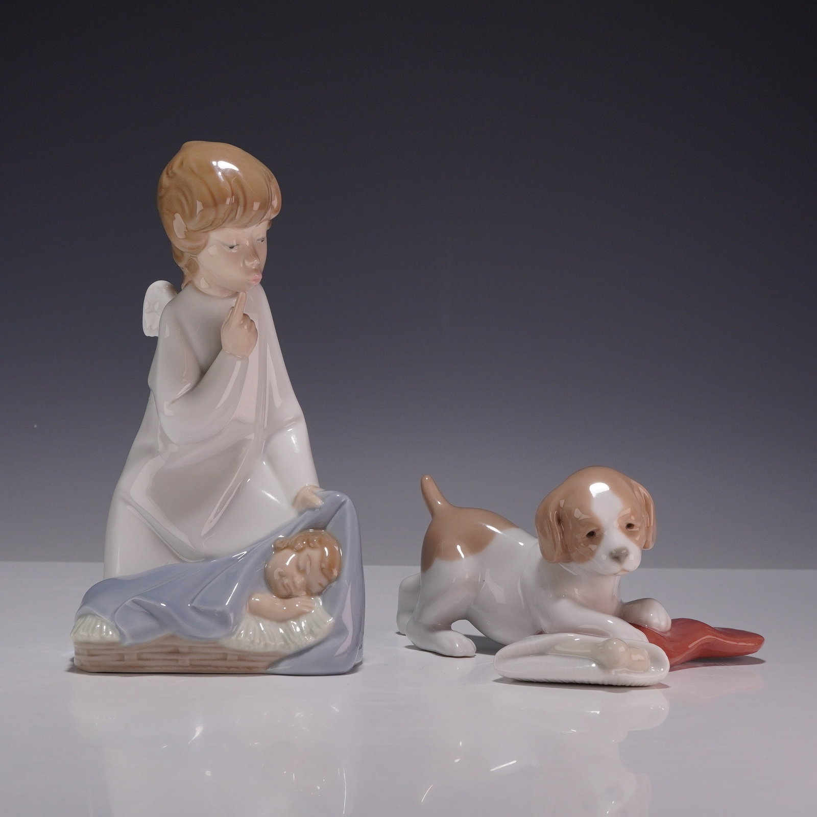 2pc Lladro and NAO Porcelain Figurines, Angel with Child and Puppy with Stocking (1 of 3)