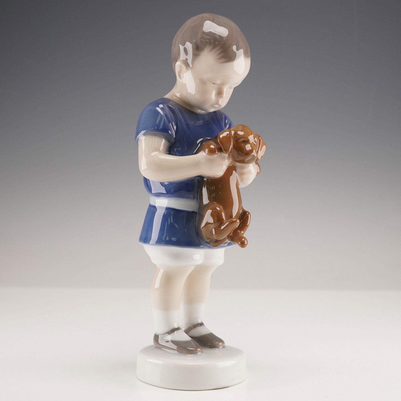 Bing & Grondahl Porcelain Figurine, Model No. 1747, 'Boy Holding Puppy' (1 of 3)