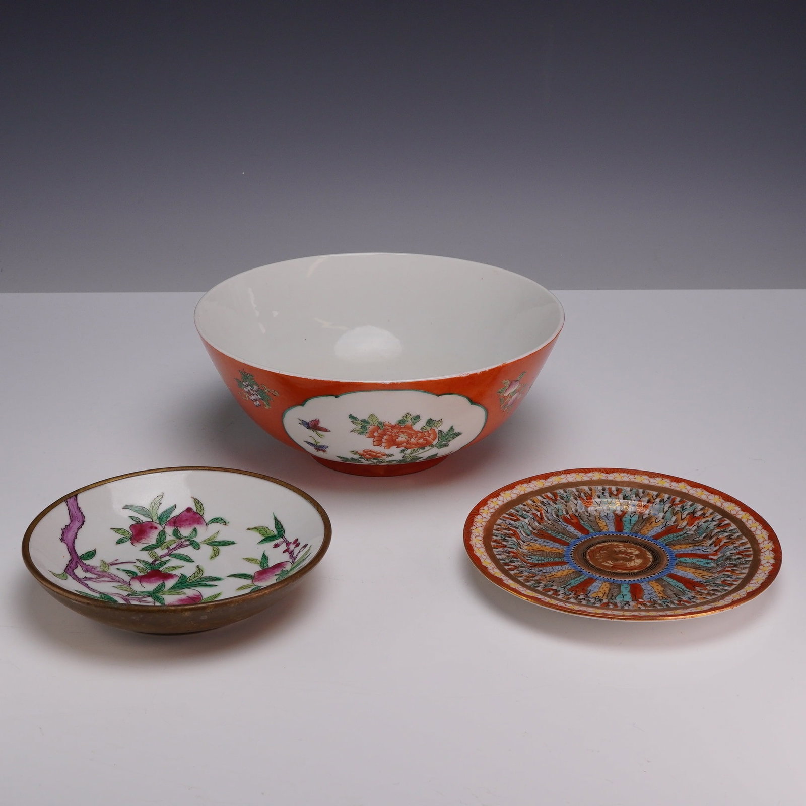 Three Piece Cantonese Porcelain Ware, Bowls and Plate: This lot consists of a three-piece collection of Cantonese porcelain ware produced for the export market in the mid-20th century. The set includes a large bowl, a small plate, and a small bowl. The