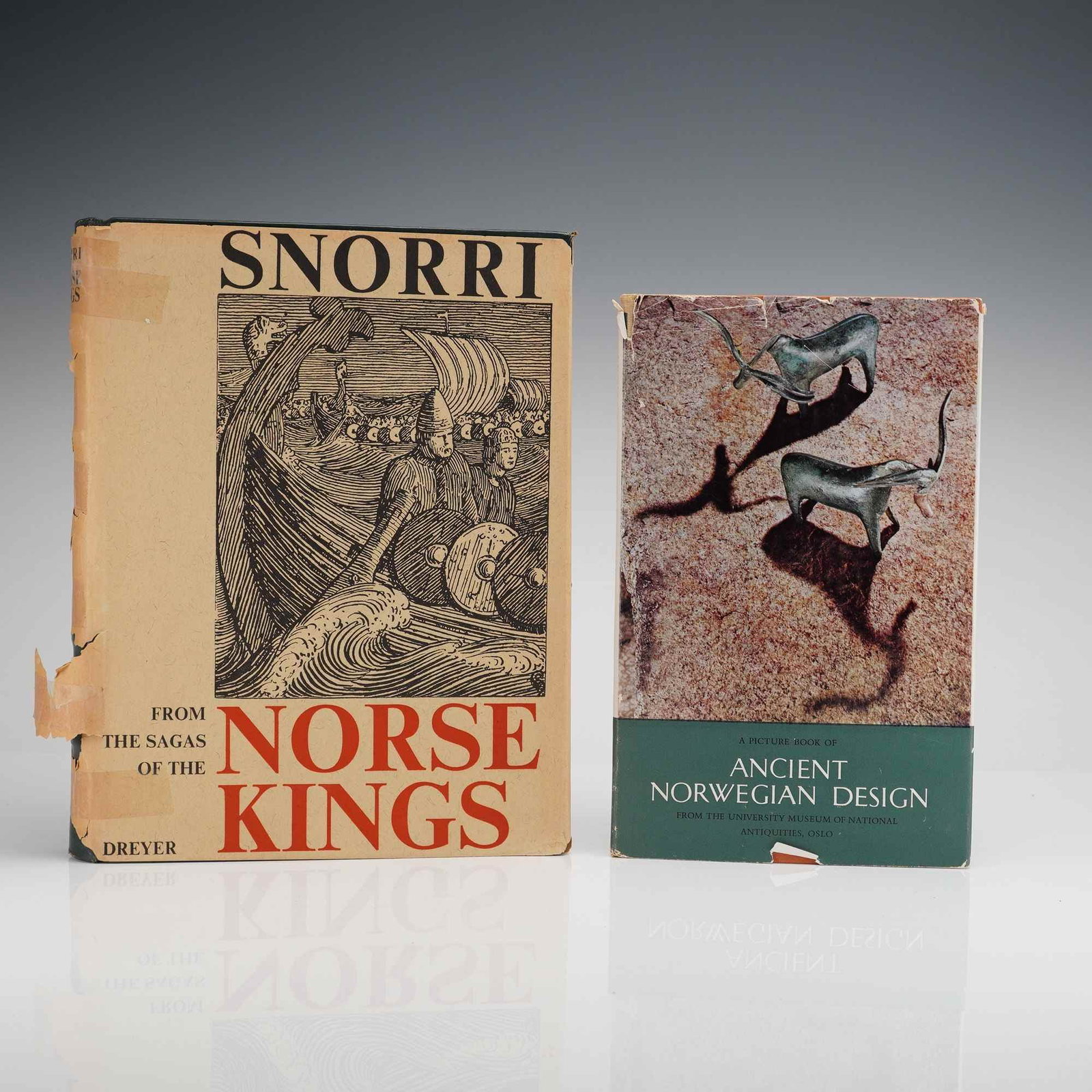2pc Snorri Norse Kings & Ancient Norwegian Design Hardcover Books: The lot consists of two hardcover volumes relating to Norse and Norwegian history and design. The first volume is from the Sagas of the Norse Kings by Snorri Sturluson (Dreyer), a dark green hardcover