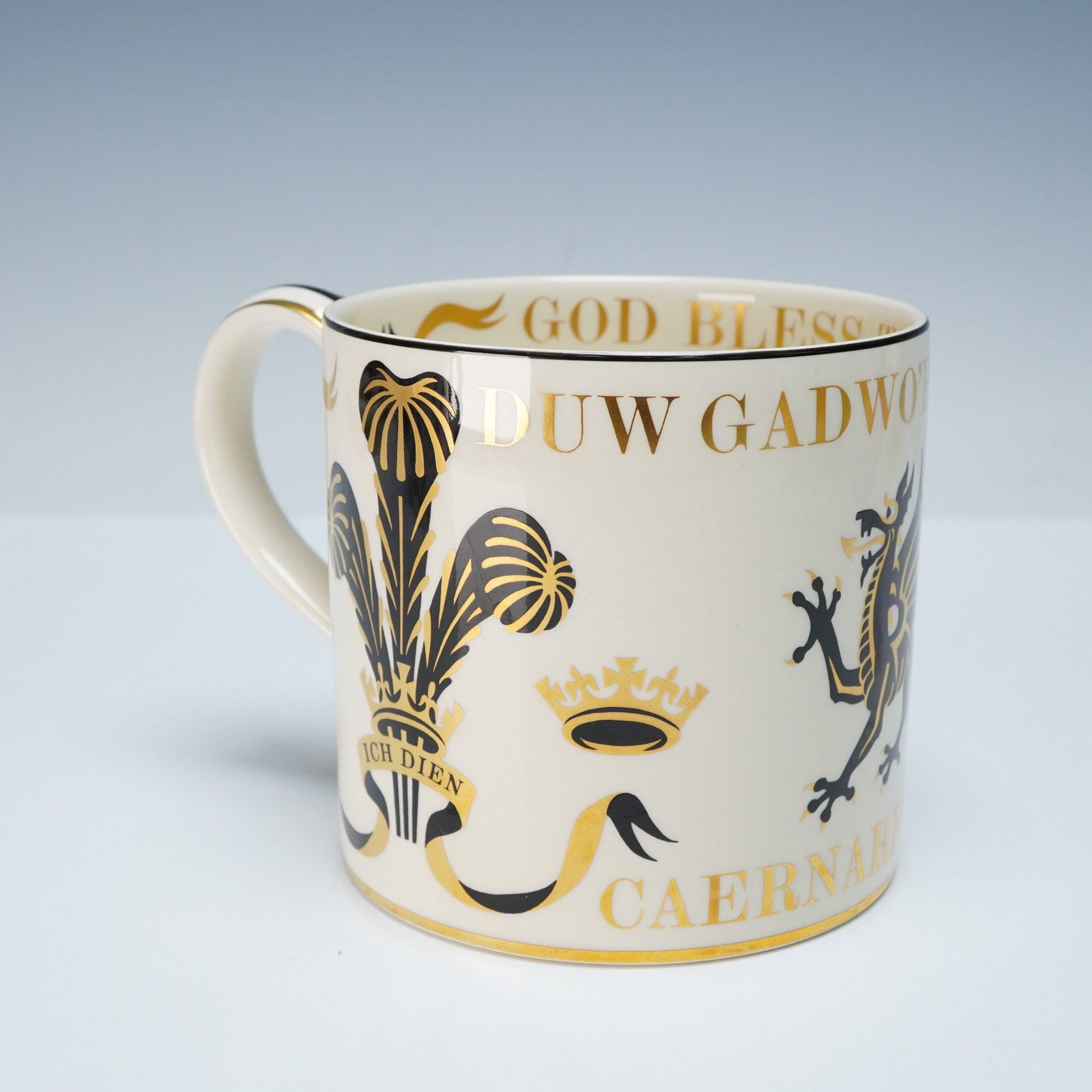 Wedgwood Mug - Prince of Wales Investiture by Richard Guyatt Design: A Wedgwood bone china commemorative mug, designed by Richard Guyatt, for the Investiture of His Royal Highness Prince Charles as Prince of Wales at Caernarvon on 1st July 1969. Crafted from Wedgwood b