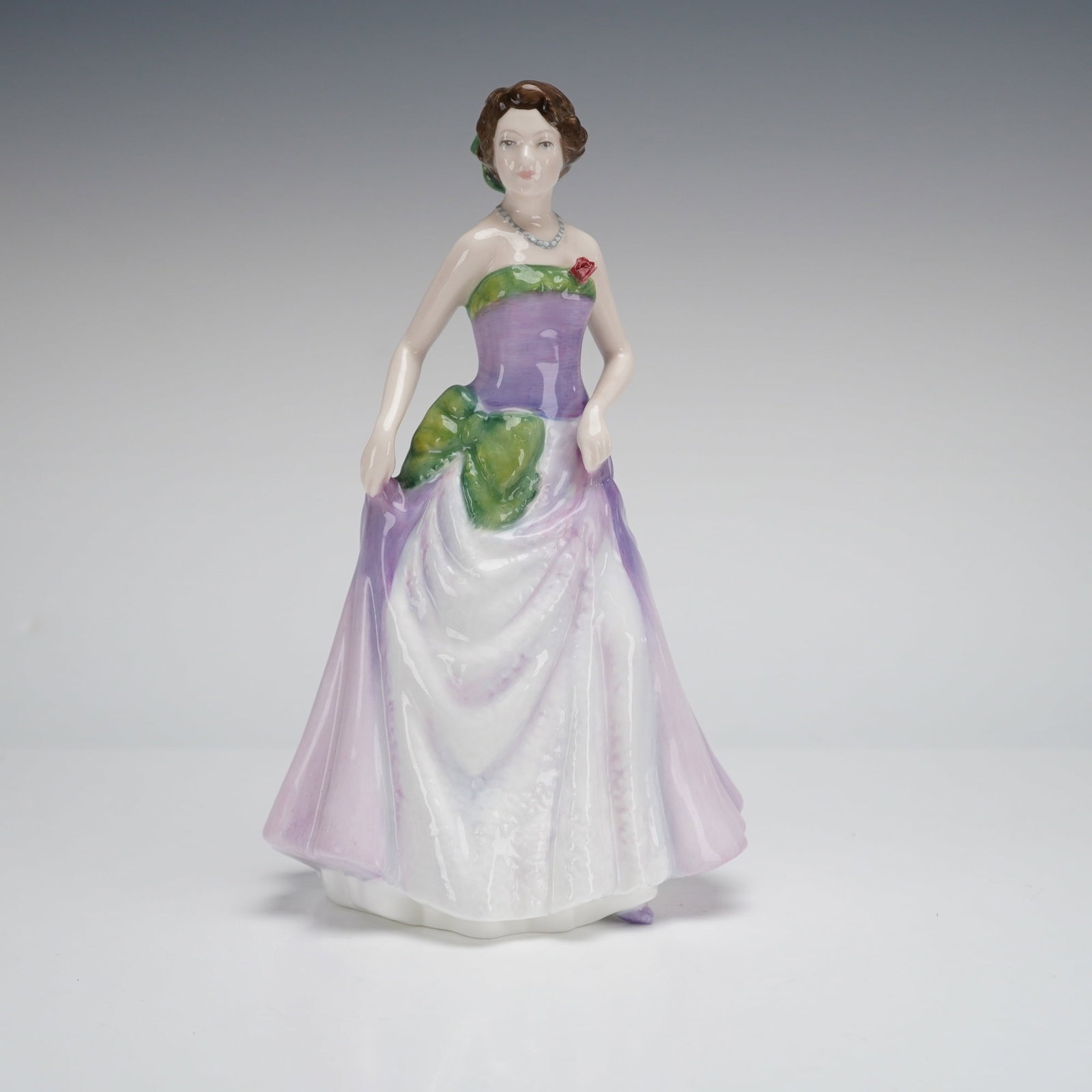 Royal Doulton Figurine of the Year 1997 Jessica HN 3850: A glazed porcelain figurine manufactured by Royal Doulton, titled "Jessica," model number HN 3850, and designated as the "Figure of the Year 1997." The figure depicts a standing female figure modeled 