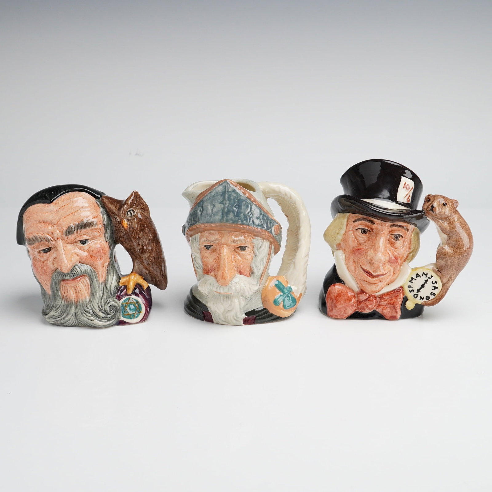 3pc Royal Doulton Character Jugs, Merlin, Don Quixote, and Mad Hatter (1 of 3)