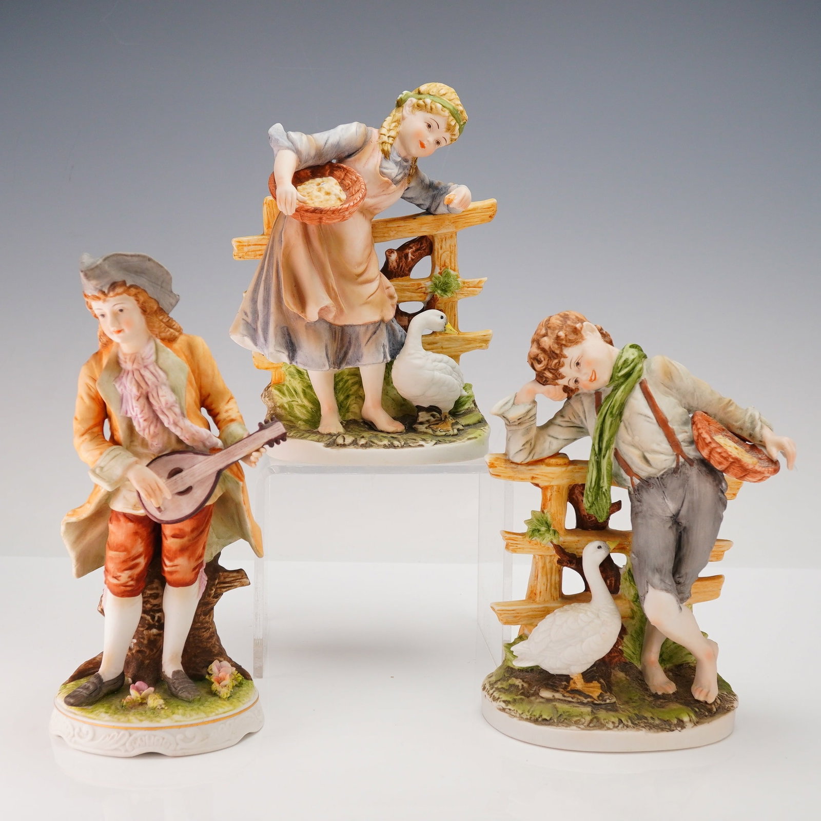 A Group of Three Polychrome Porcelain Figurines (1 of 3)