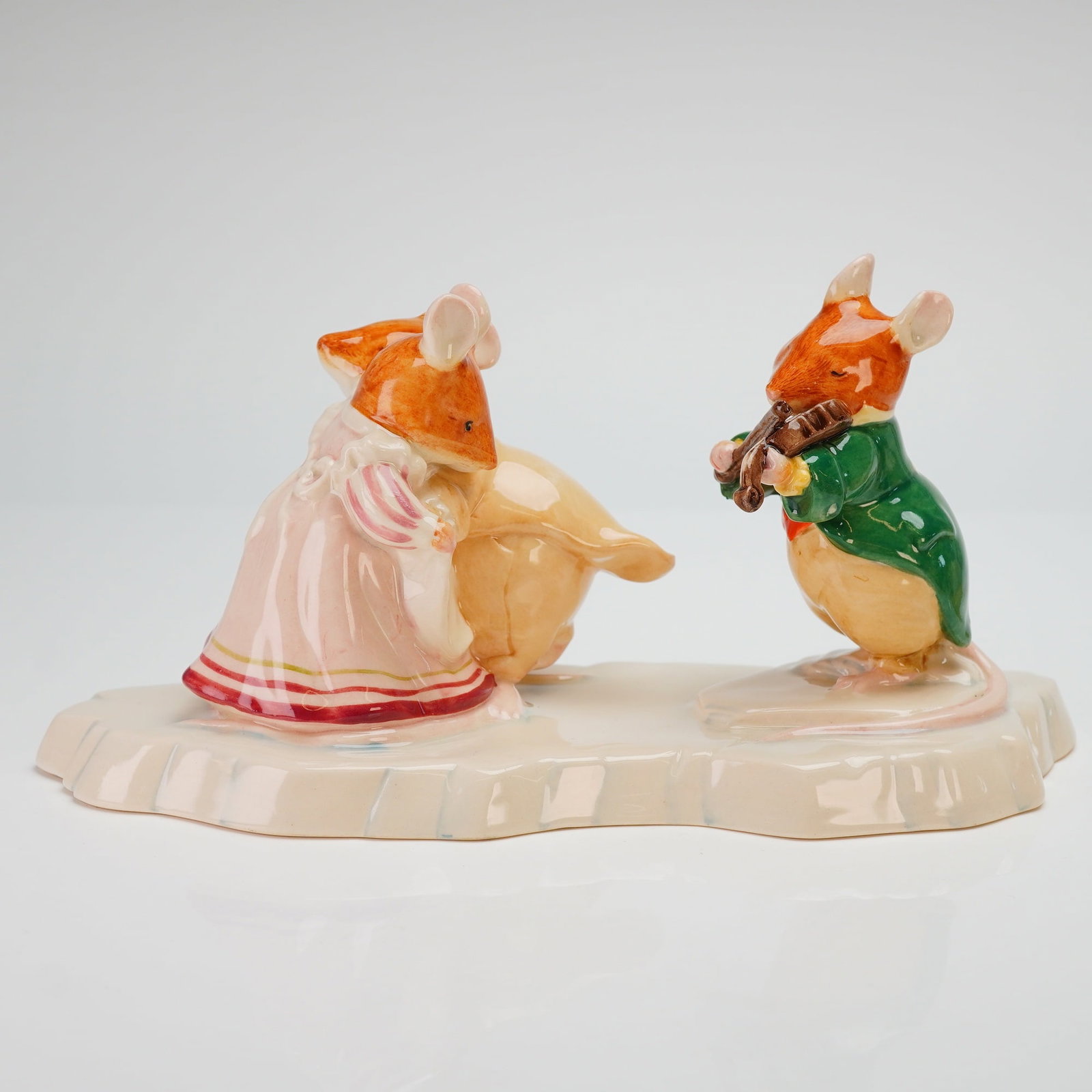 Royal Doulton Brambly Hedge Figurine, The Ice Ball DBH30: The piece is hand-made and hand-decorated, modeled by Shane Ridge based on the illustrations of Jill Barklem. The scene depicts three anthropomorphic mice on a base designed to resemble a sheet of ice