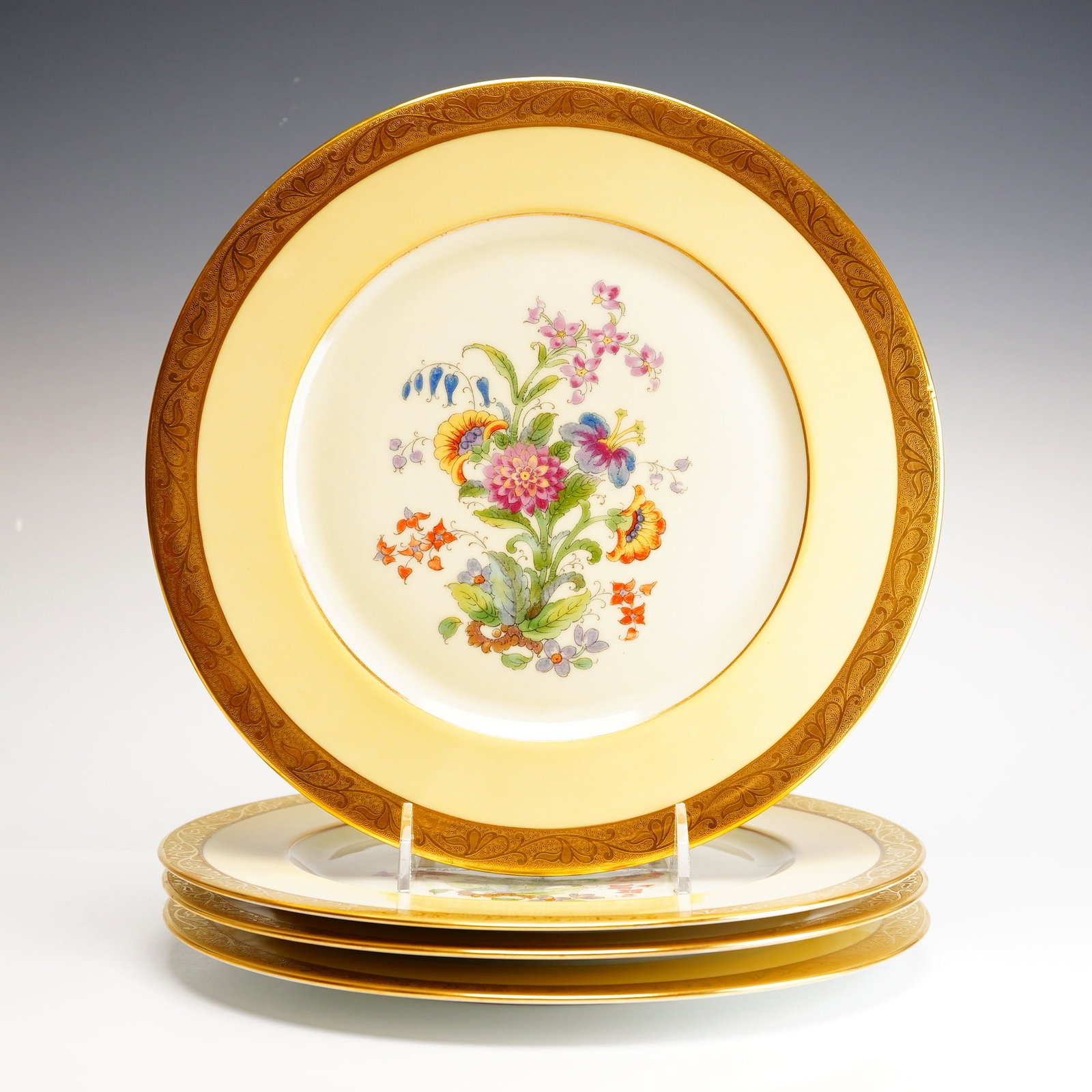 Heinrich & Co. Selb Bavaria Pickard 22K Gold Dinner Plates: This set of four fine white porcelain plates represents a collaboration between German manufacturing and American artistry. Produced by Heinrich & Co. in Selb, Bavaria, and decorated by the renowned P