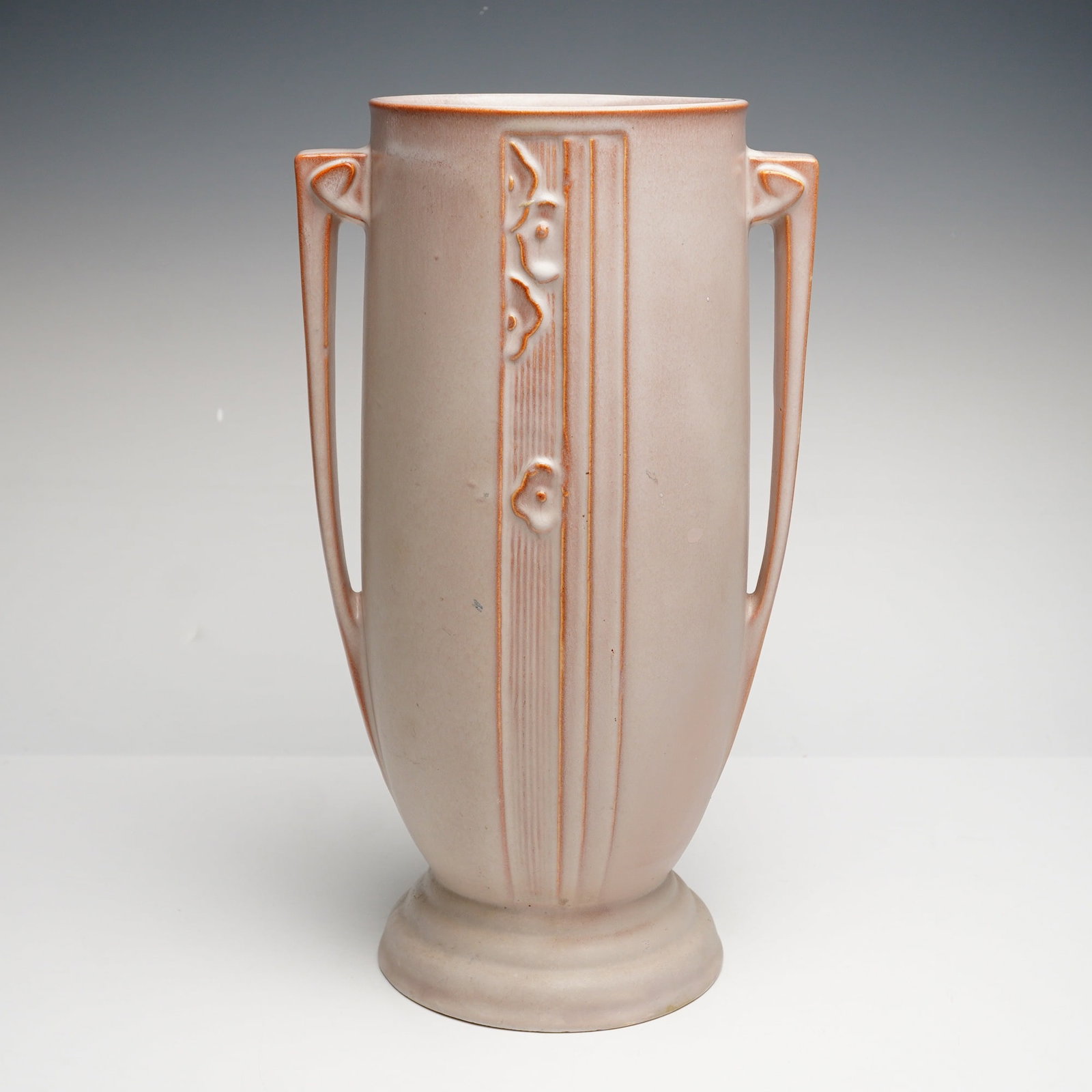 Roseville Pottery Two-Handled Vase, Moderne: A fine example of American art pottery produced by the Roseville Pottery Company of Zanesville, Ohio. This earthenware vase is executed in the Moderne pattern, introduced in 1936, which represents the