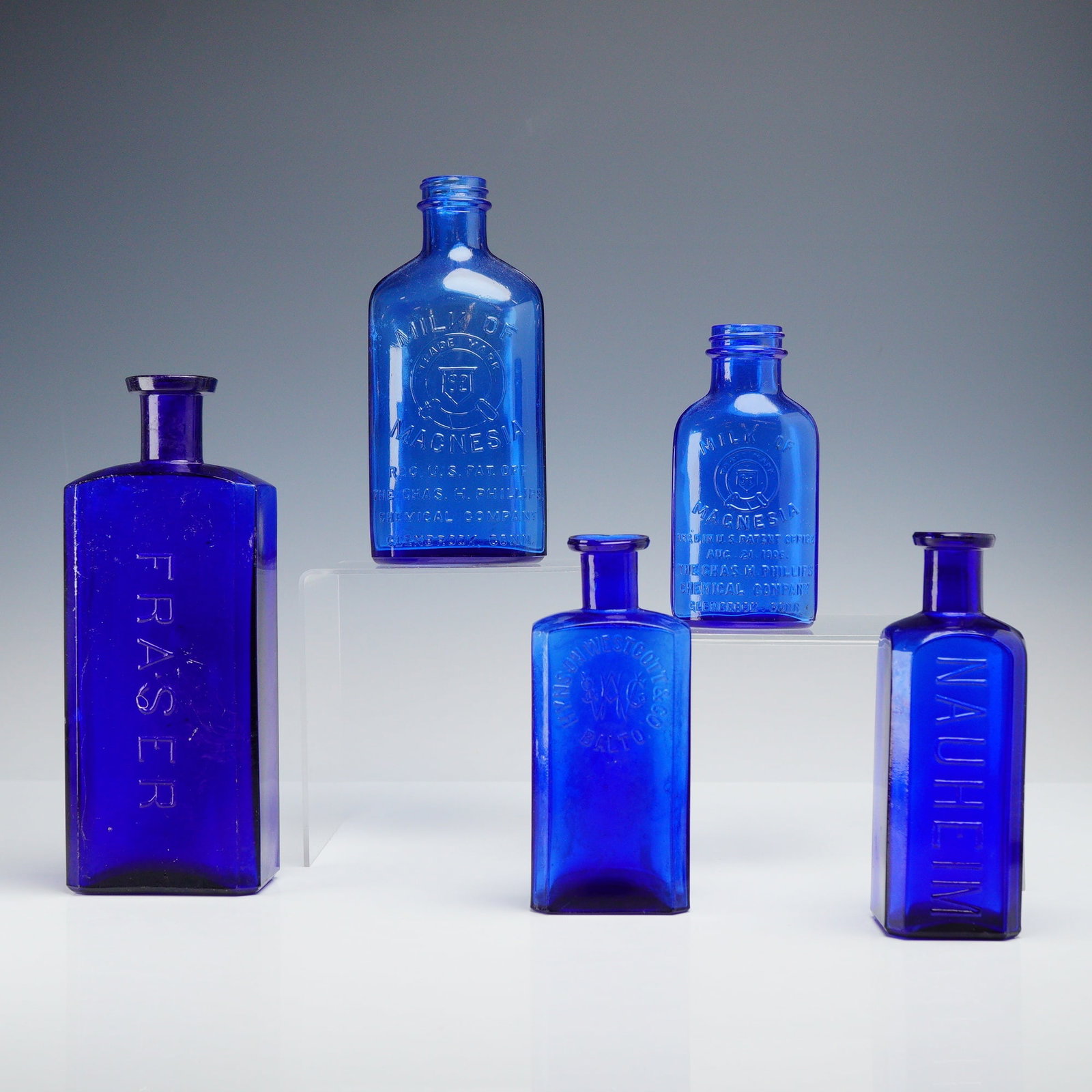 Collection of Five Antique Cobalt Blue Glass Apothecary and Phillips Milk of Magnesia Bottles (1 of 3)