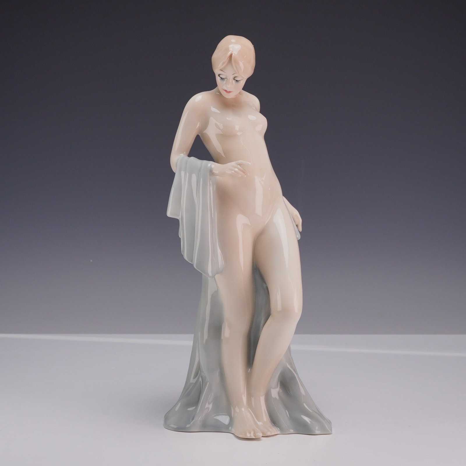 Royal Doulton Reflections Bathing Beauty Glazed Figurine HN 3156: A Royal Doulton glazed porcelain figurine titled Bathing Beauty from the Reflections series, model number HN 3156. The figure depicts a semi-nude young woman in a graceful pose, partially draped with 