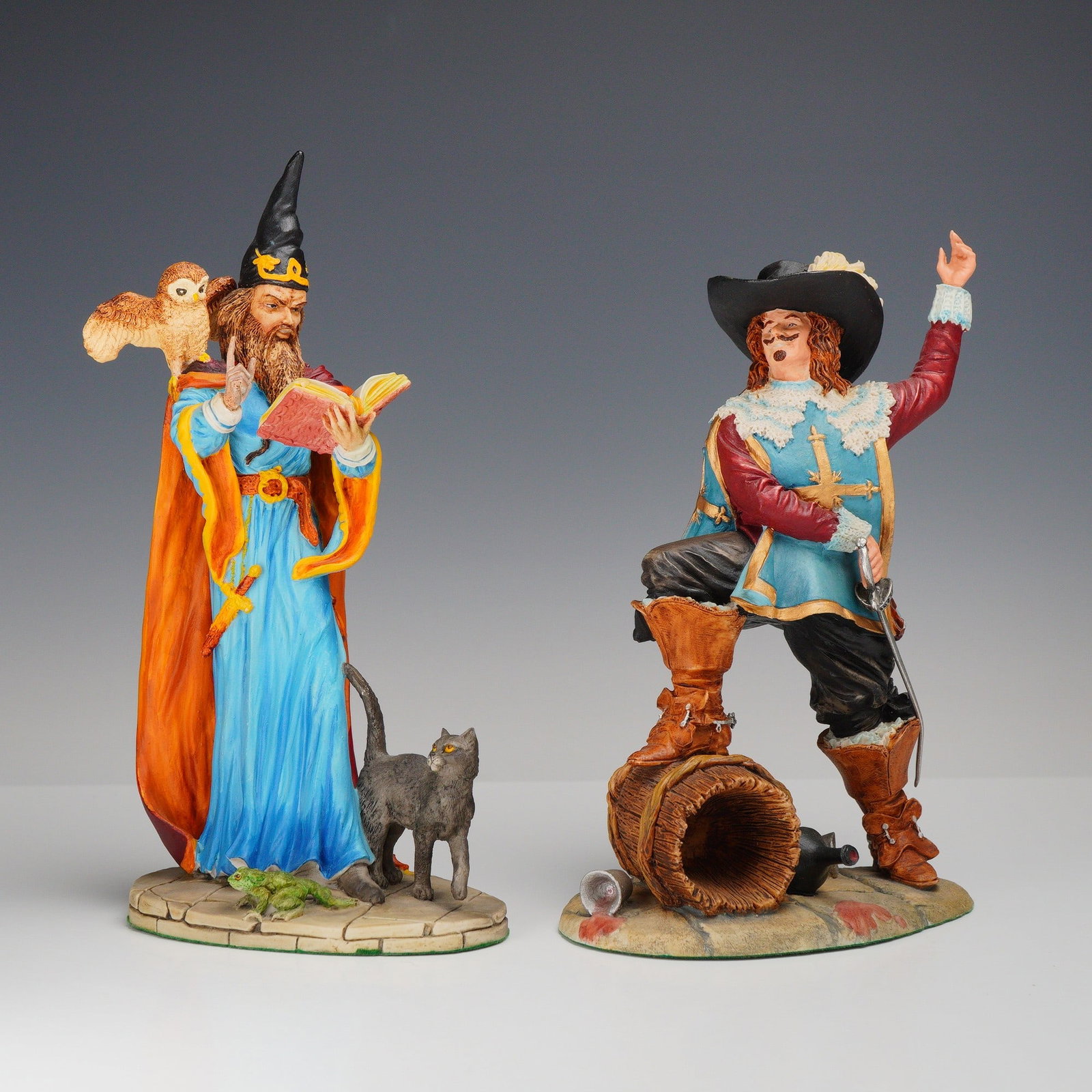 2pc Royal Doulton Hand-Made Sculpture Series, D' Artagnan (HN 3638) & The Wizard (HN 3732): This lot features a pair of hand-painted matte-finished figurines from the Royal Doulton hand-made Sculpture series, including D'Artagnan (HN 3638) and the Wizard(HN 3732). The D'Artagnan figurine dep