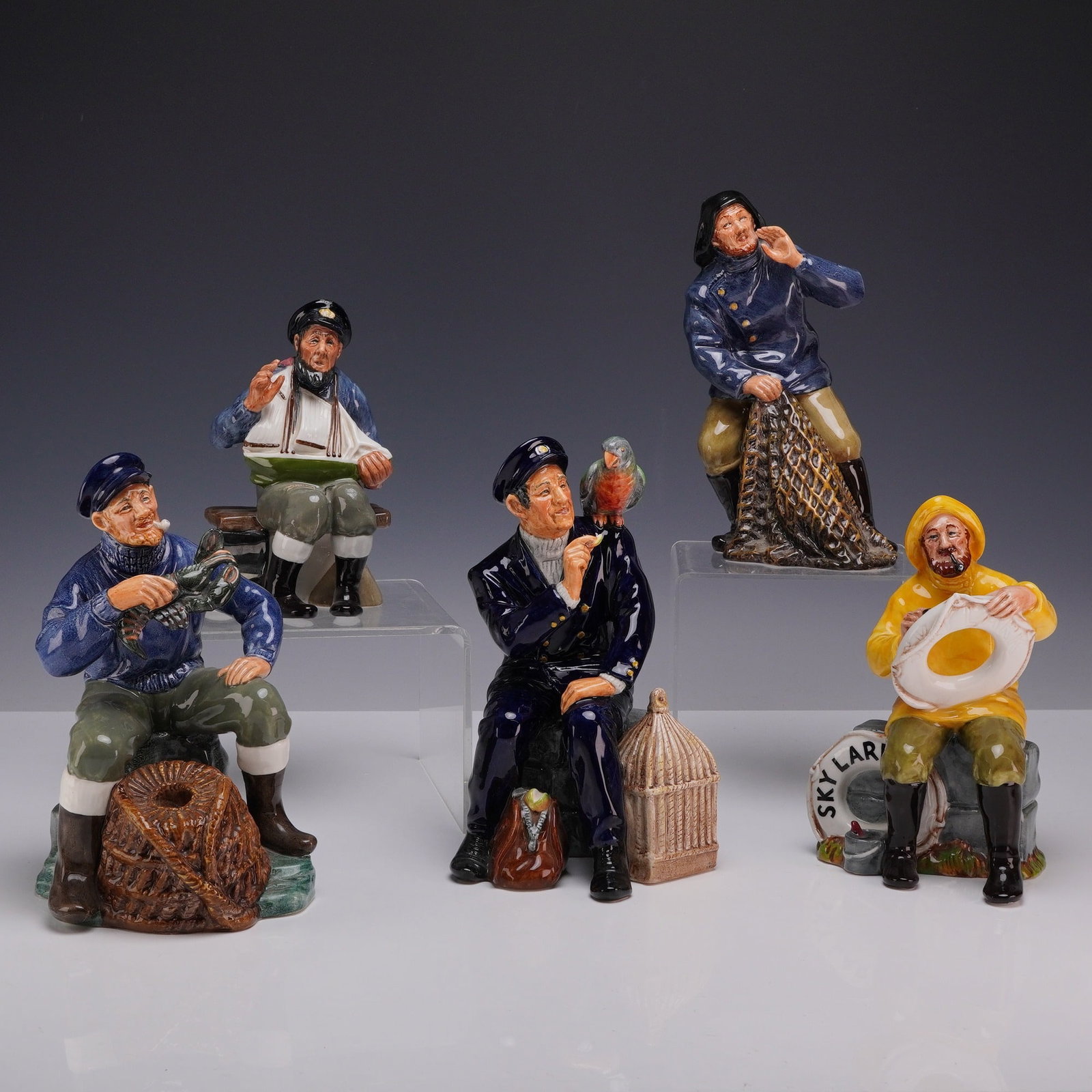 Lot of Five Royal Doulton Seafaring Porcelain Figurines: This lot consists of a collection of 5 Royal Doulton seafaring figurines, including Shore Leave, The Boatman, Sea Harvest, The Lobster Man, and the model representing maritime tall story traditions, T