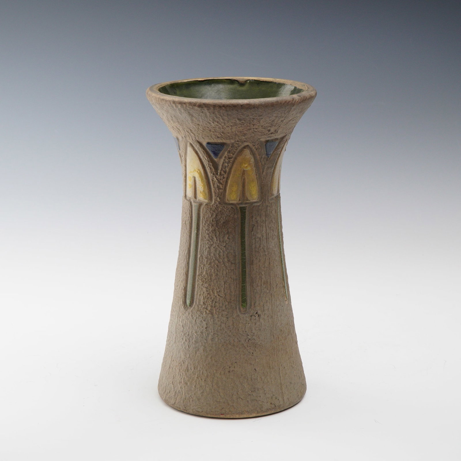 Roseville Pottery Mostique Vase: A striking Roseville Pottery vase from the Mostique line, circa 1916. This hand-thrown Arts and Crafts period example features a tall, flaring form with a textured matte exterior in earthy brown tones