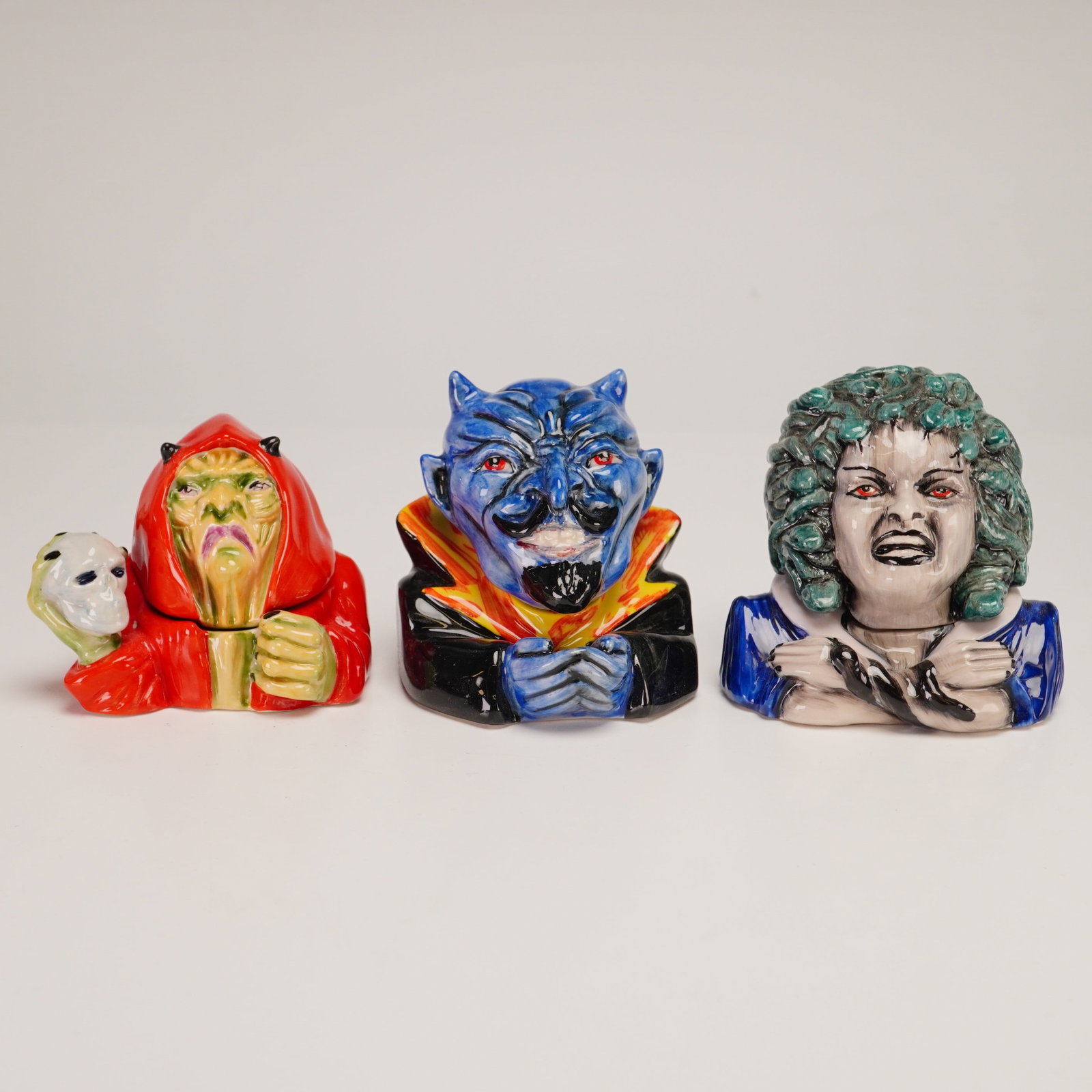 3pc Kevin Francis Ceramic Face Pots, Medusa, The Warlock, and Devil: A trio of collectible ceramic miniature lidded face pots manufactured by Kevin Francis in England. This group features three distinct supernatural characters rendered in hand-painted glazed ceramic wi