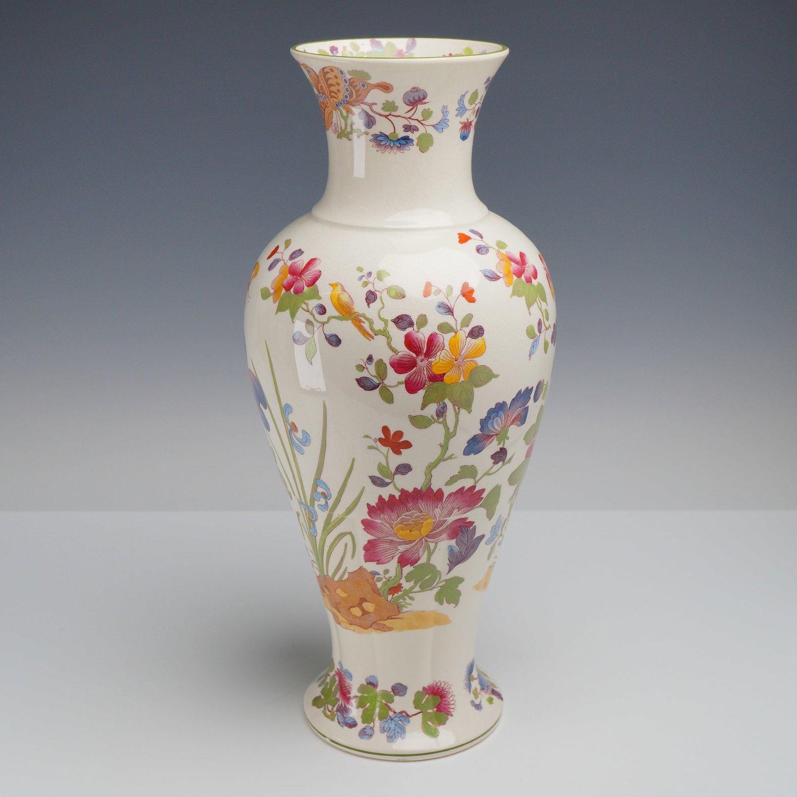 Wedgwood Etruria Earthenware Baluster Vase, English Groups Pattern c. 1911: The vessel features a classic baluster form characterized by a rounded shoulder, tapered neck, and flared rim and foot. The exterior is adorned with hand-painted overglaze polychrome decoration consis