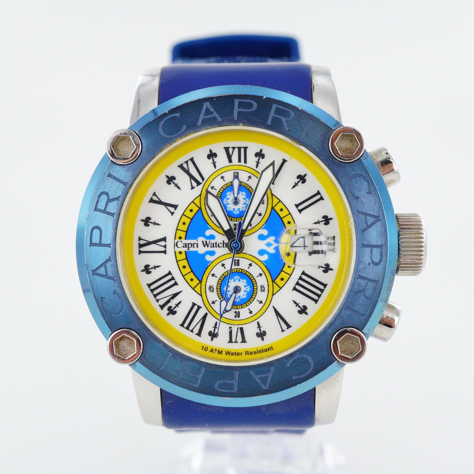 Capri Watch by Silvio Staiano Blue Stainless Steel Chronograph Wristwatch: This Capri Watch by Silvio Staiano is a chronograph wristwatch featuring a blue ion-plated 316L stainless steel case and bezel. The dial features a white and yellow color scheme with blue accents, mar