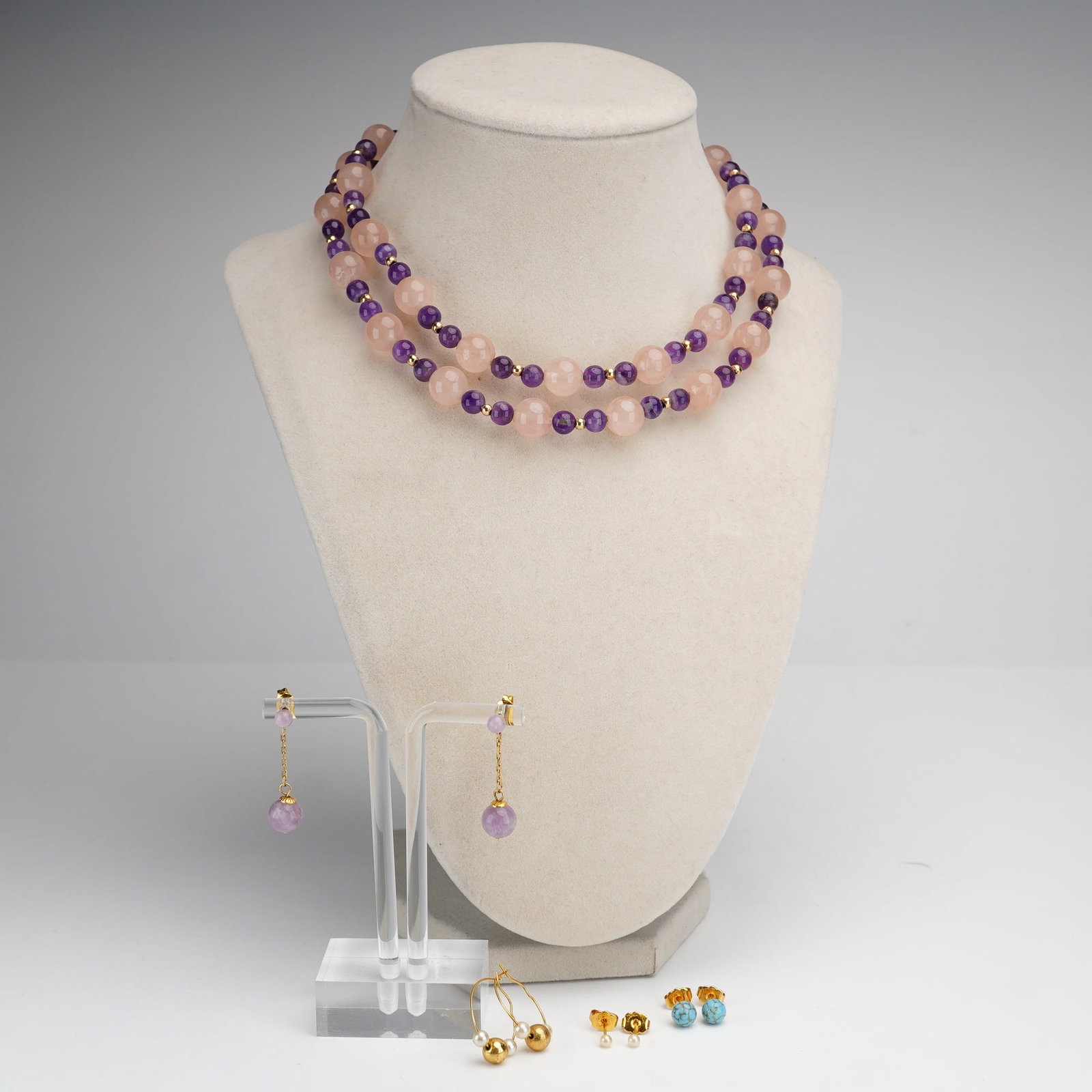 9pc Jewelry Lot Including 14K Beaded Necklace and Four Pairs of Earrings: A nine-piece collection of jewelry featuring a long-strand beaded necklace and four pairs of earrings, with components marked by Simply Whispers. The necklace is composed of a long strand of polished 