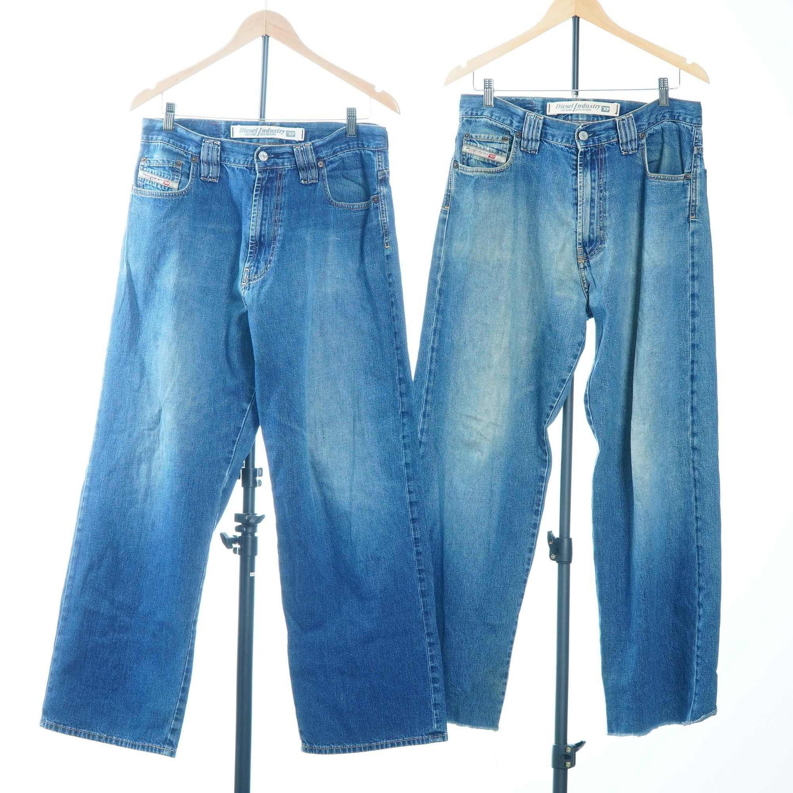 2pc Diesel Denim Jeans, Size 31: This lot features two pairs of Diesel denim jeans in size 31. Both garments are identified as Diesel Industry Denim Division apparel and are marked as Type RR55 Superior Quality Jeans on the rear leat