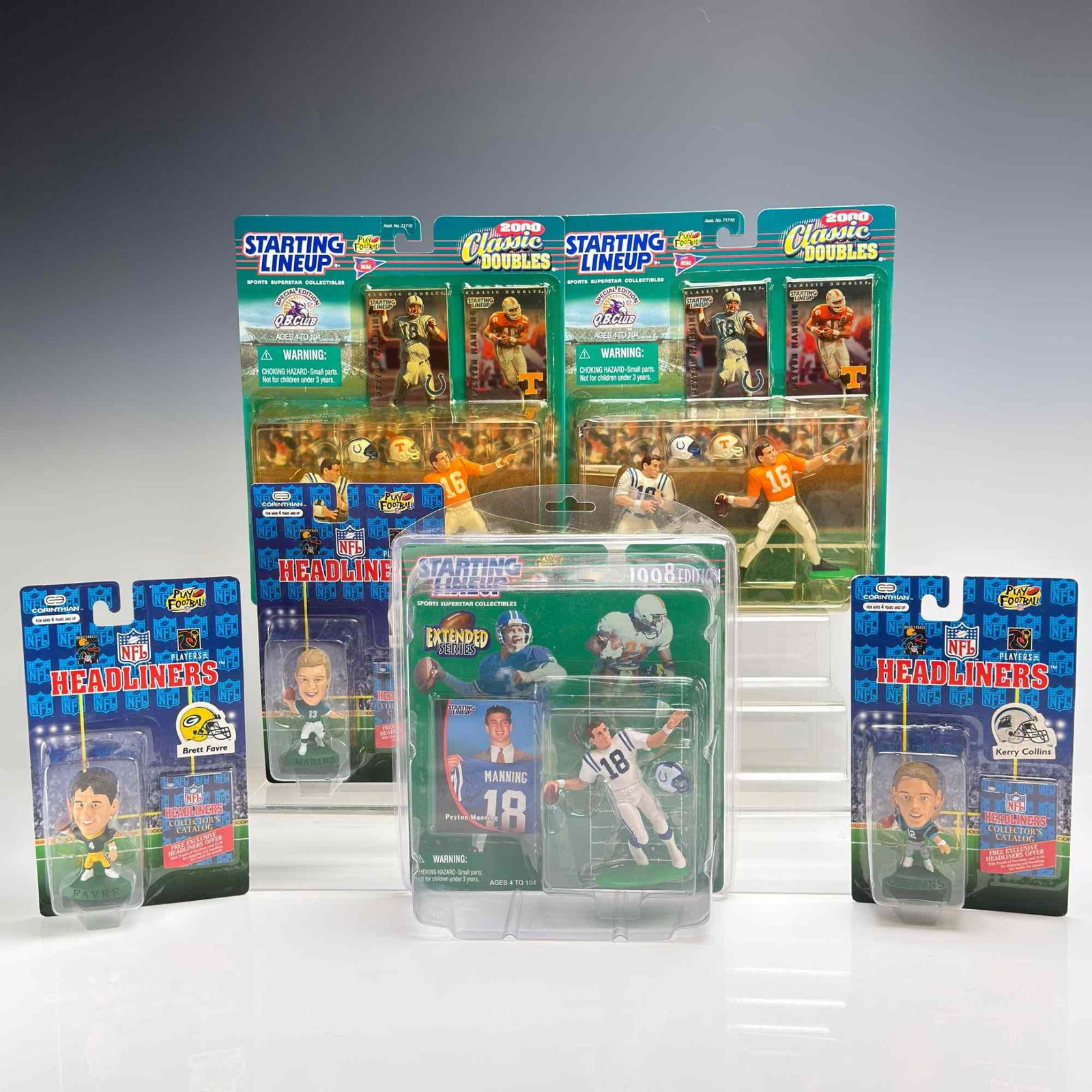 6pc Starting Line Action Figures and Headliners Bobbleheads: This lot features a collection of six vintage American football collectibles, including action figures and bobblehead-style figurines, all contained within their original factory-sealed blister packag