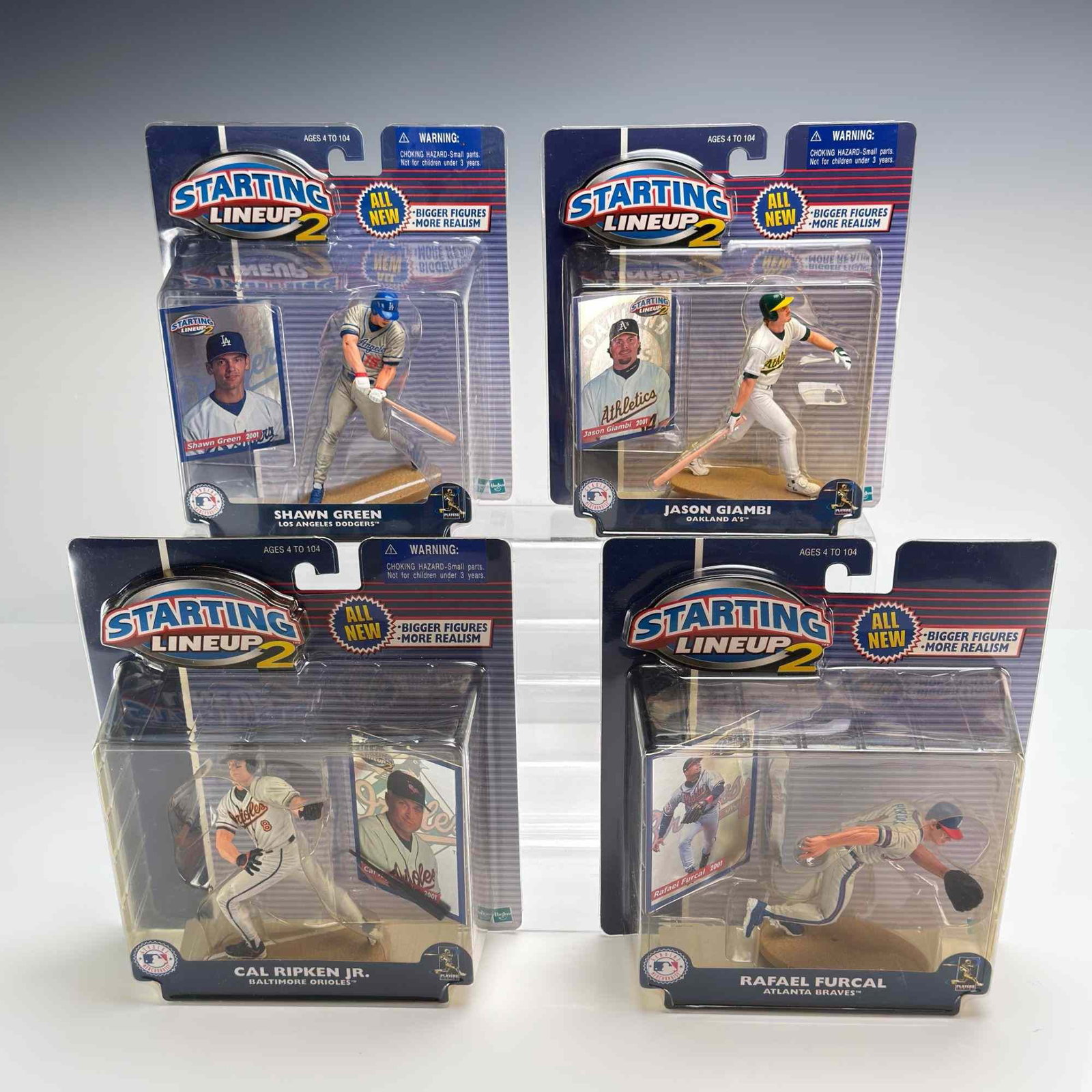 4pc 2001 Hasbro Starting Lineup 2 MLB Action Figures: This lot comprises four factory-sealed Major League Baseball action figures from the 2001 Starting Lineup 2 series produced by Hasbro. This specific series was designed at a larger scale with enhanced