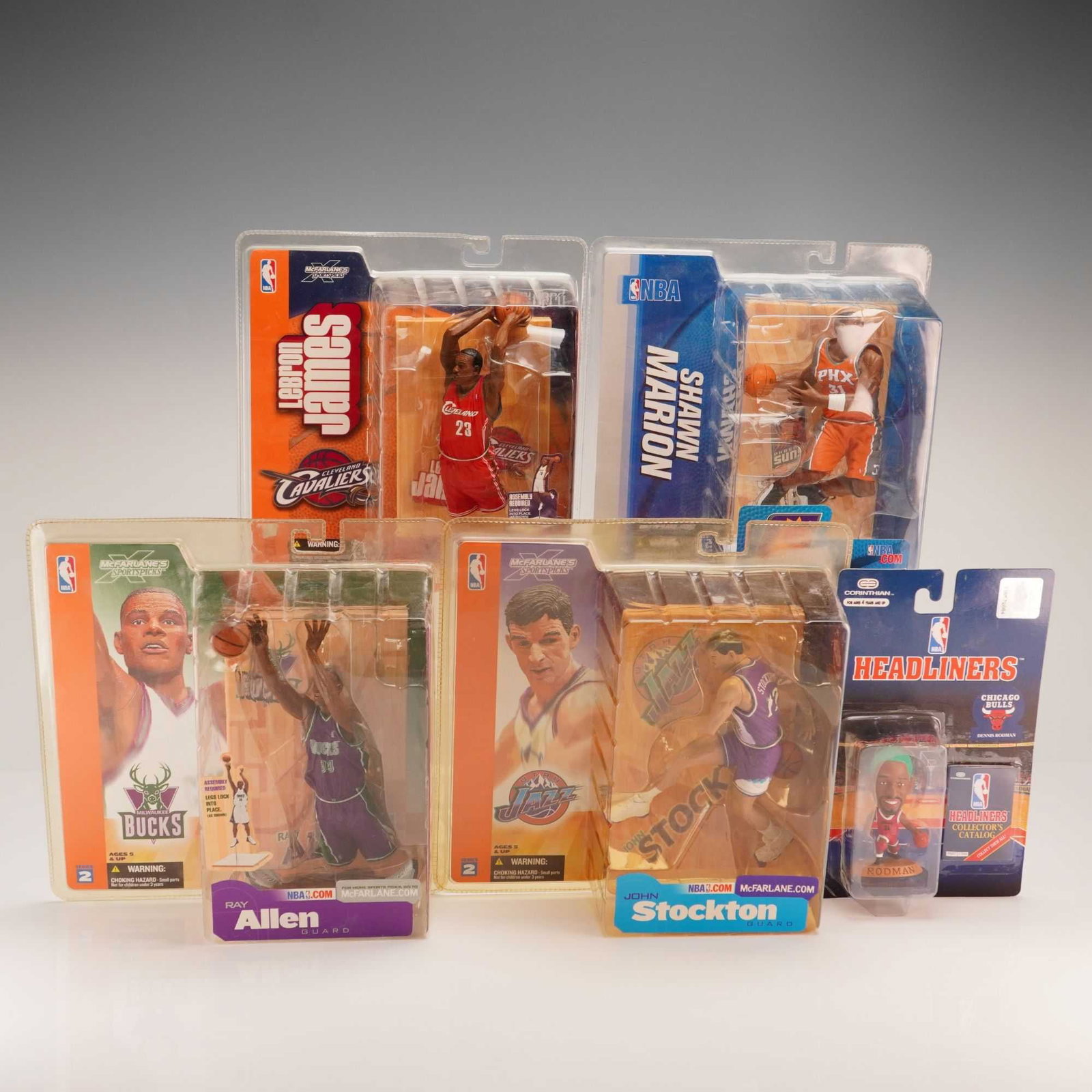 5pc NBA figurines in boxes featuring LeBron James and McFarlane Sportspicks: A collection of five NBA figurines in boxes primarily featuring the McFarlane Toys Sportspicks line. The lot includes the following figures in their original factory-sealed blister-pack packaging: LeB