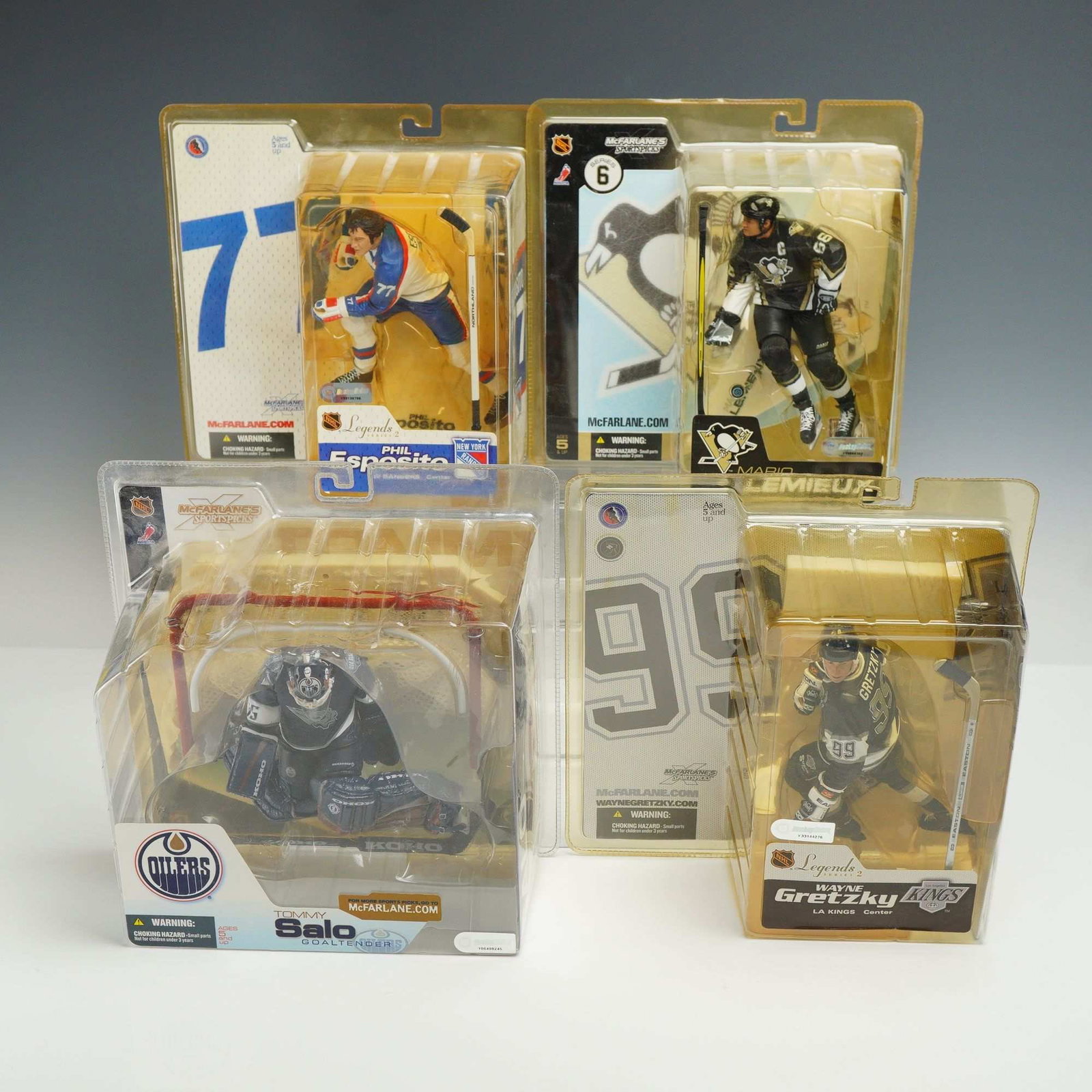 4 McFarlane Toys NHL Sportspicks Action Figures in Original Packaging: A collection of 4 collectible NHL hockey action figures produced by McFarlane Toys as part of the McFarlane's Sportspicks line. Each figure is housed in its original blister packaging and includes a d