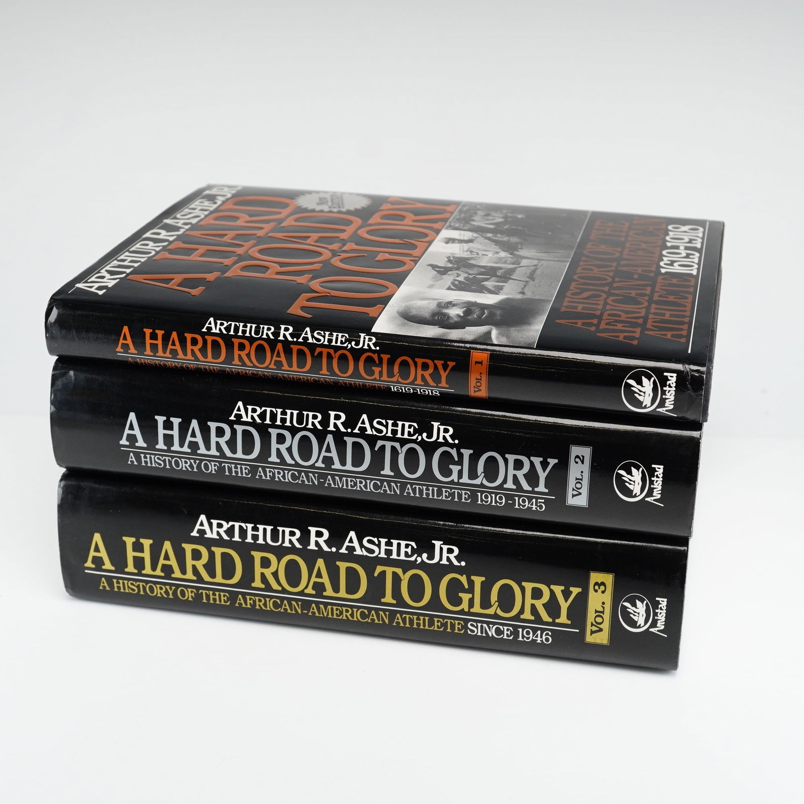 Three Ashe, Arthur R., Jr. A Hard Road to Glory: A History of the African-American Athlete. Amistad,: A complete three-volume set of the updated hardcover edition of A Hard Road to Glory: A History of the African-American Athlete by Arthur R. Ashe, Jr. Published by Amistad Press, Inc. in May 1993,