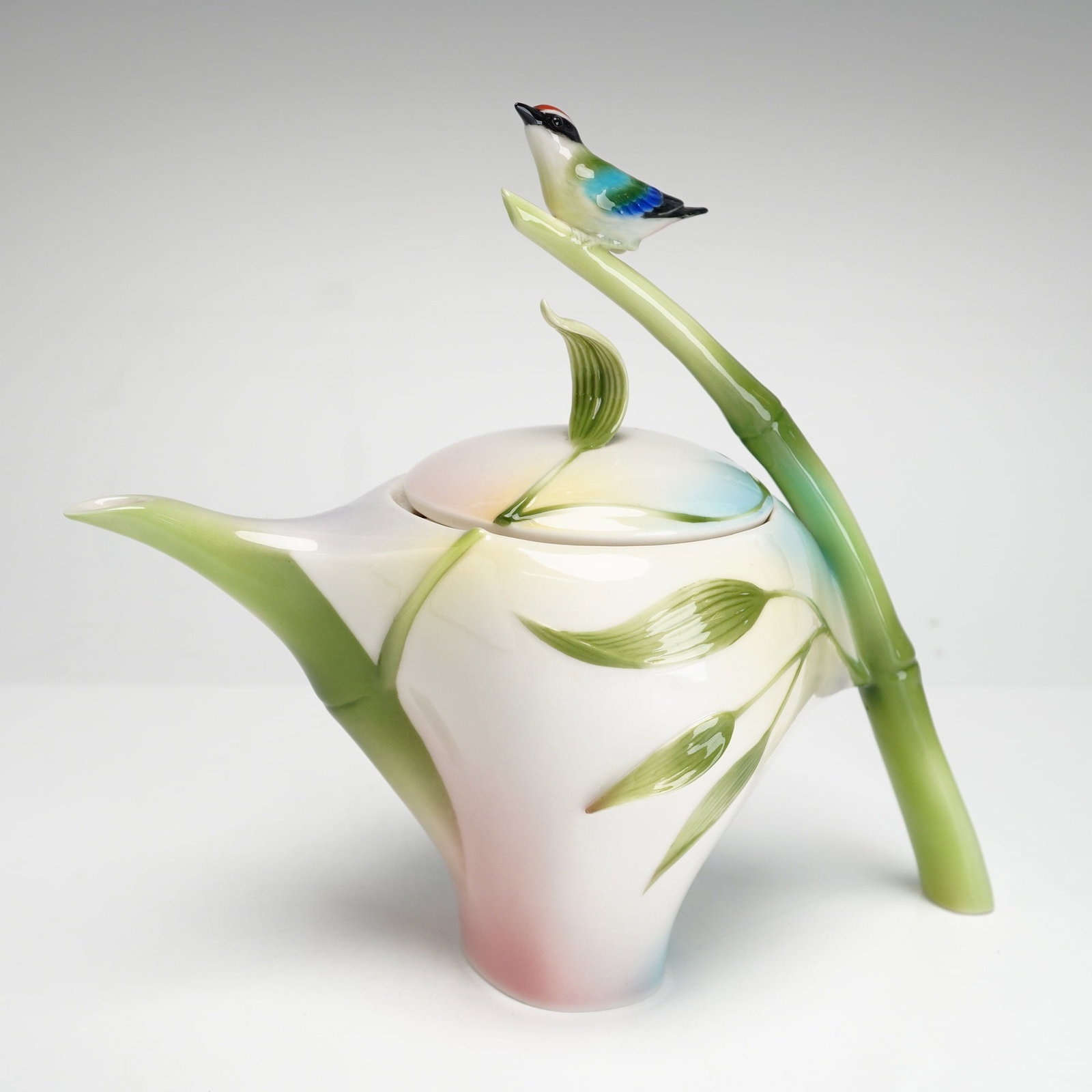 Franz Collection Bamboo Song Bird Porcelain Teapot by James Tsai: A contemporary fine porcelain teapot from the Franz Collection featuring the Bamboo Song Bird motif designed by James Tsai. This highly sculptural piece is crafted in an organic form with a handle mod