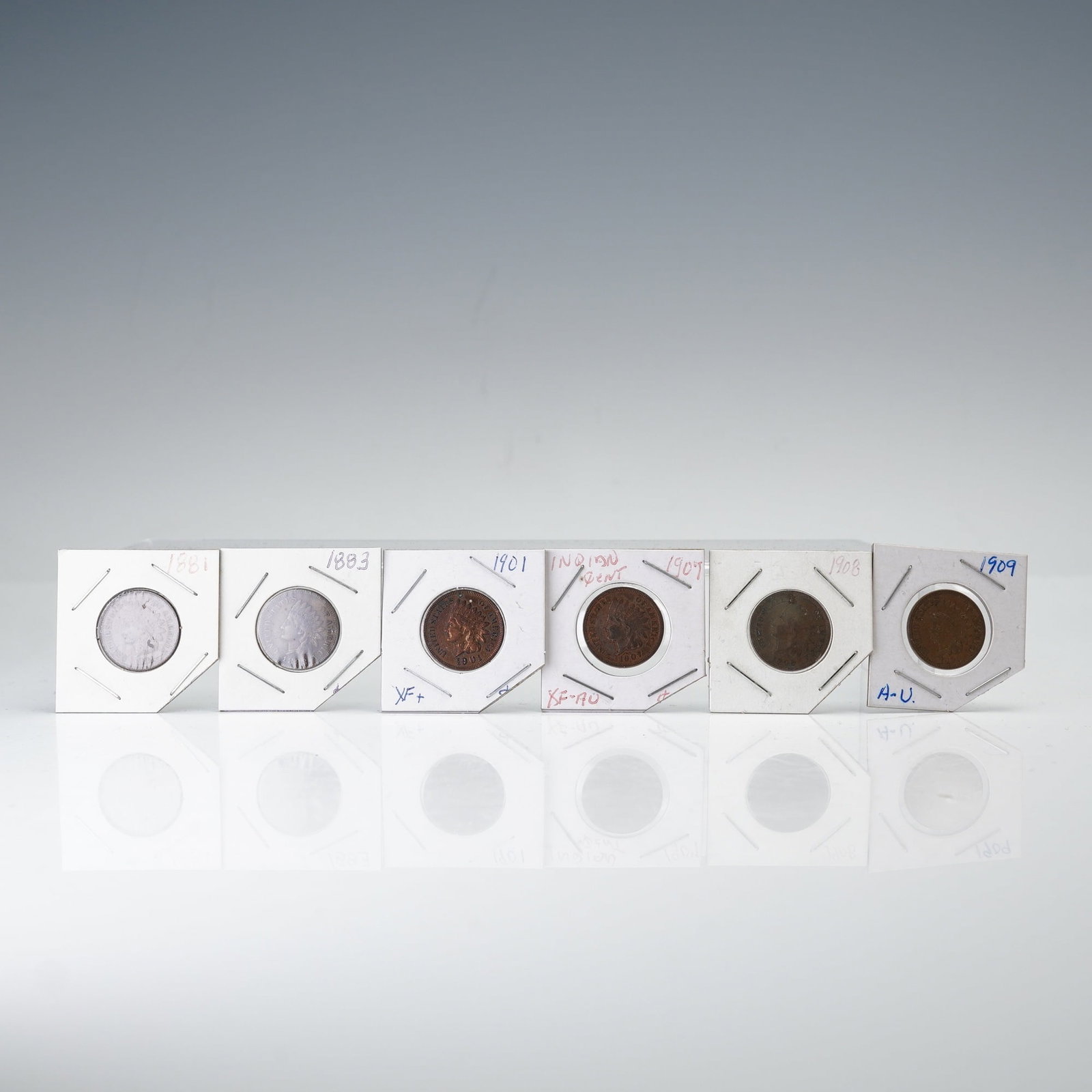 6pc 1881 to 1909 Indian Head 1 Cent Coins: Dated 1881, 1883, 1901, 1904, 1906, and 1909, each struck at the Philadelphia Mint with a composition of 95 percent copper and 5 percent tin and zinc and a standard weight of 3.11 grams. The obverse d