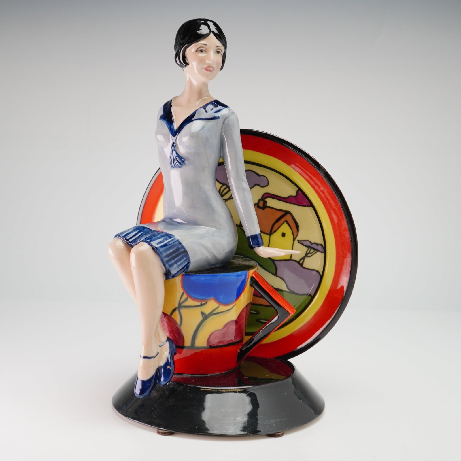 Kevin Francis Ceramics Limited Edition Figurine, Young Clarice Cliff: The piece is part of a limited edition of 900, designated as American Edition number 100, and was produced in Staffordshire, England. The figurine depicts a stylized representation of the artist Clari