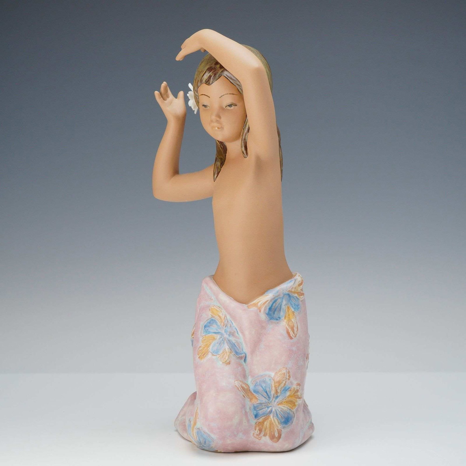 Lladro Gres Porcelain Figuring, Tropical Flower 01012385: A beautifully sculpted Lladro Gres porcelain figurine titled Tropical Flower (Model No. 01012385), designed by noted artist Jose Javier Malavia. This charming composition depicts a young island girl s
