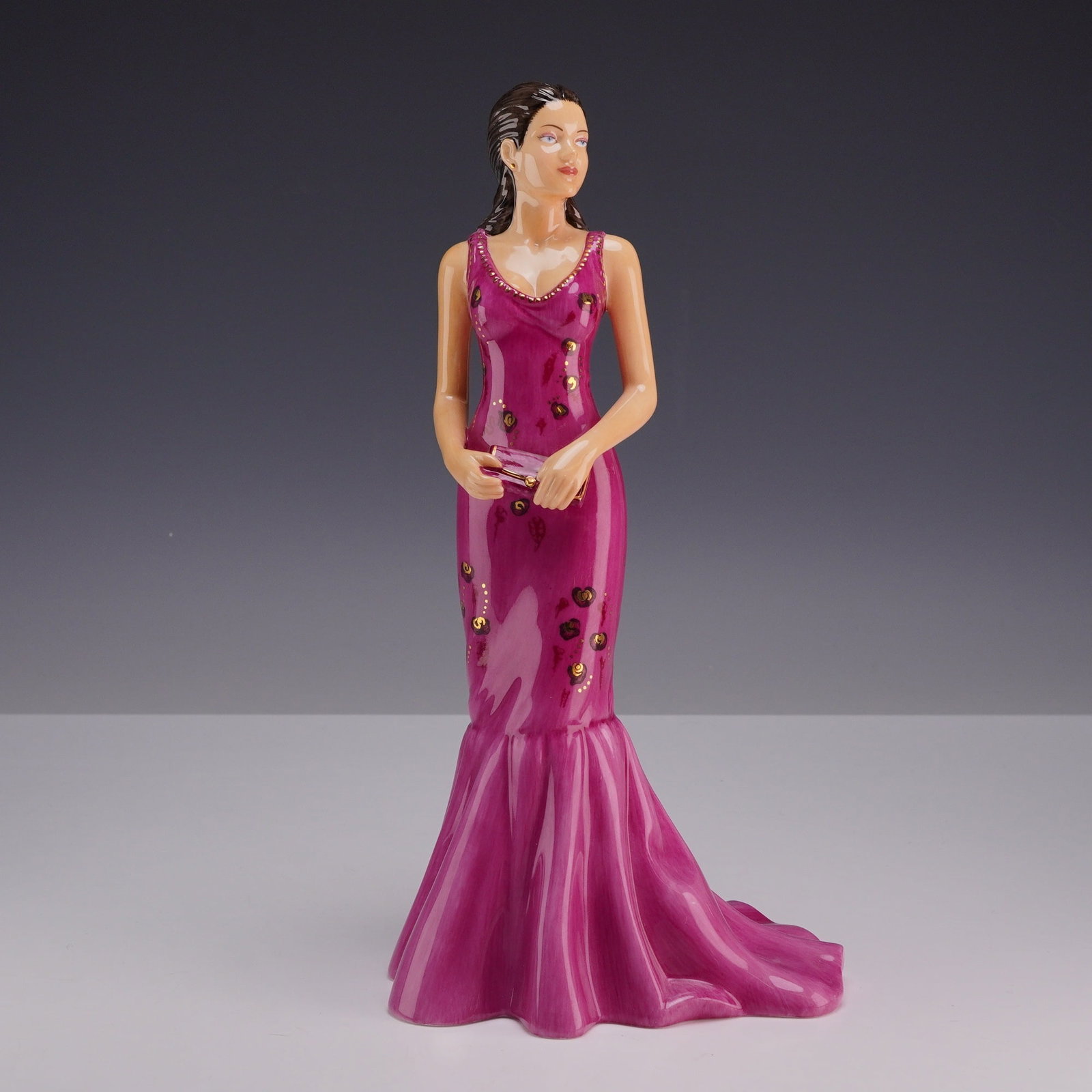 Royal Doulton Pretty Ladies Carmen Bone China Figurine HN 5059: This hand-made and hand-decorated fine bone china figurine from Royal Doulton is titled Carmen, model number HN 5059, from the Pretty Ladies collection. The piece depicts a female figure in a standing