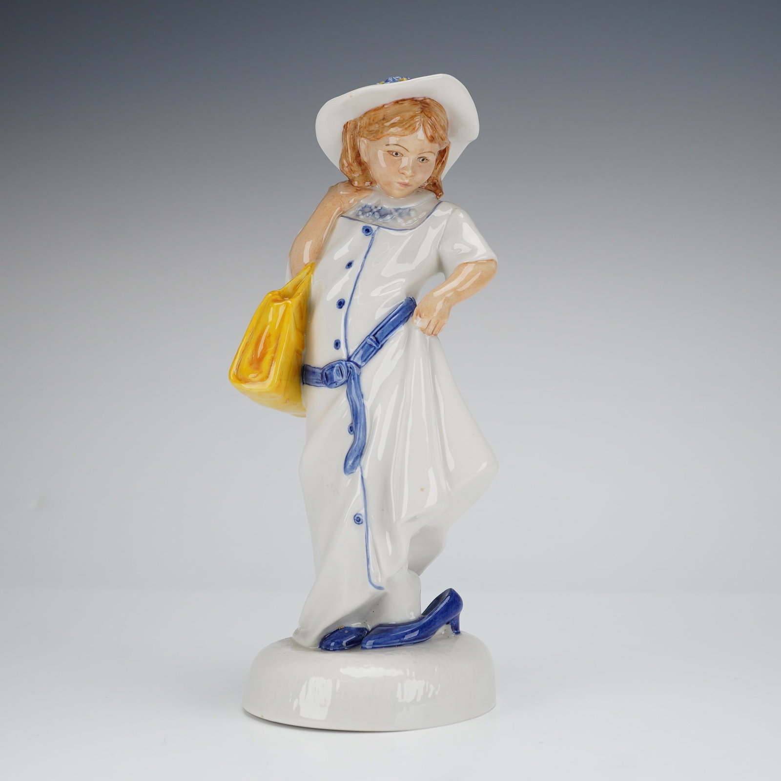 Royal Doulton Childhood Days Dressing Up HN2964 Figurine: A single glazed bone china figurine by Royal Doulton, titled 'Dressing Up,' model number HN 2964, from the 'Childhood Days' series. The figure depicts a young girl in a long, white, hand-painted coat 