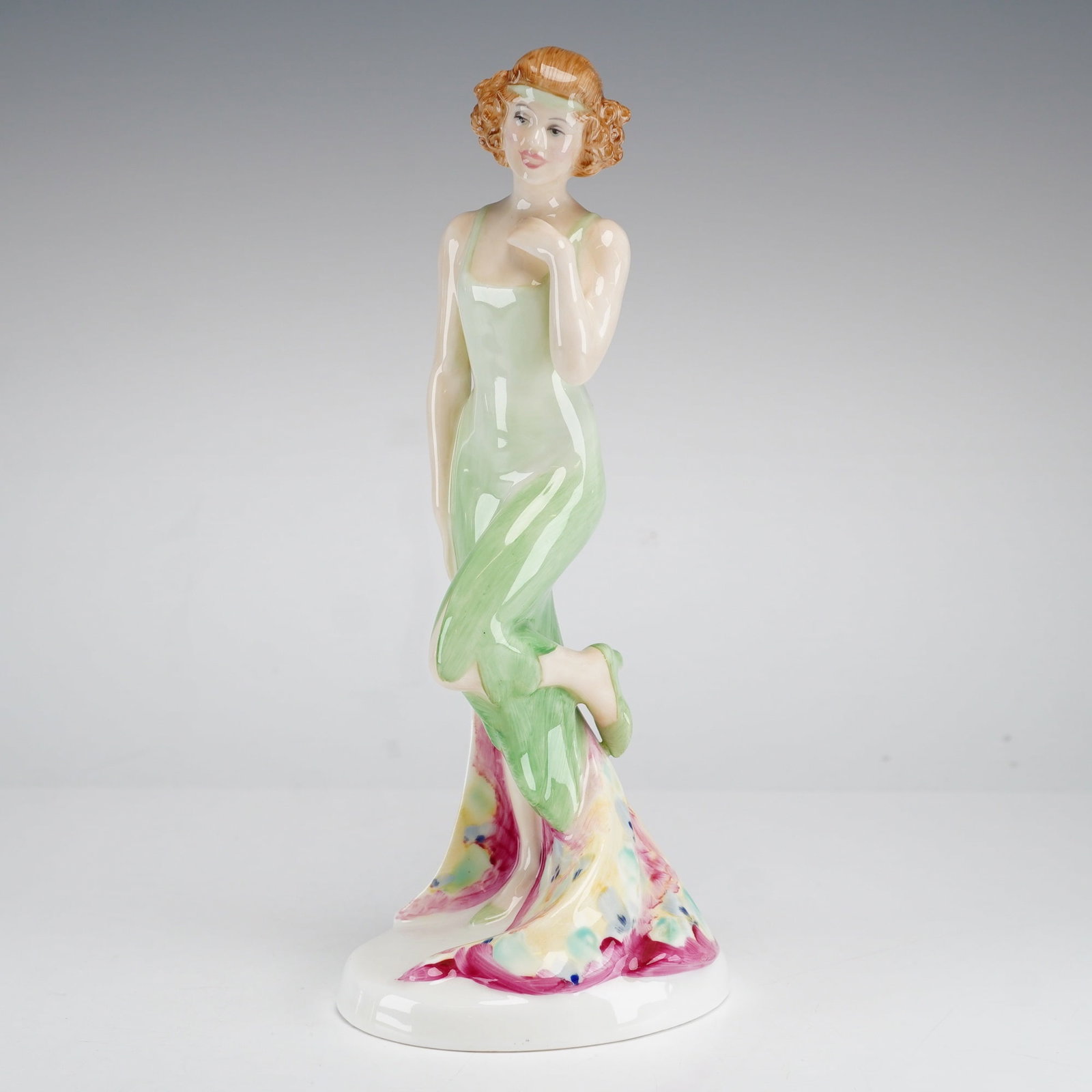 Royal Doulton Sweet & Twenties Collection Figurine, Monte Carlo HN 2332: This Royal Doulton porcelain figurine, titled Monte Carlo, is part of the Sweet & Twenties collection. The figure depicts a young woman in stylized 1920s evening attire, wearing a sleeveless pale gree