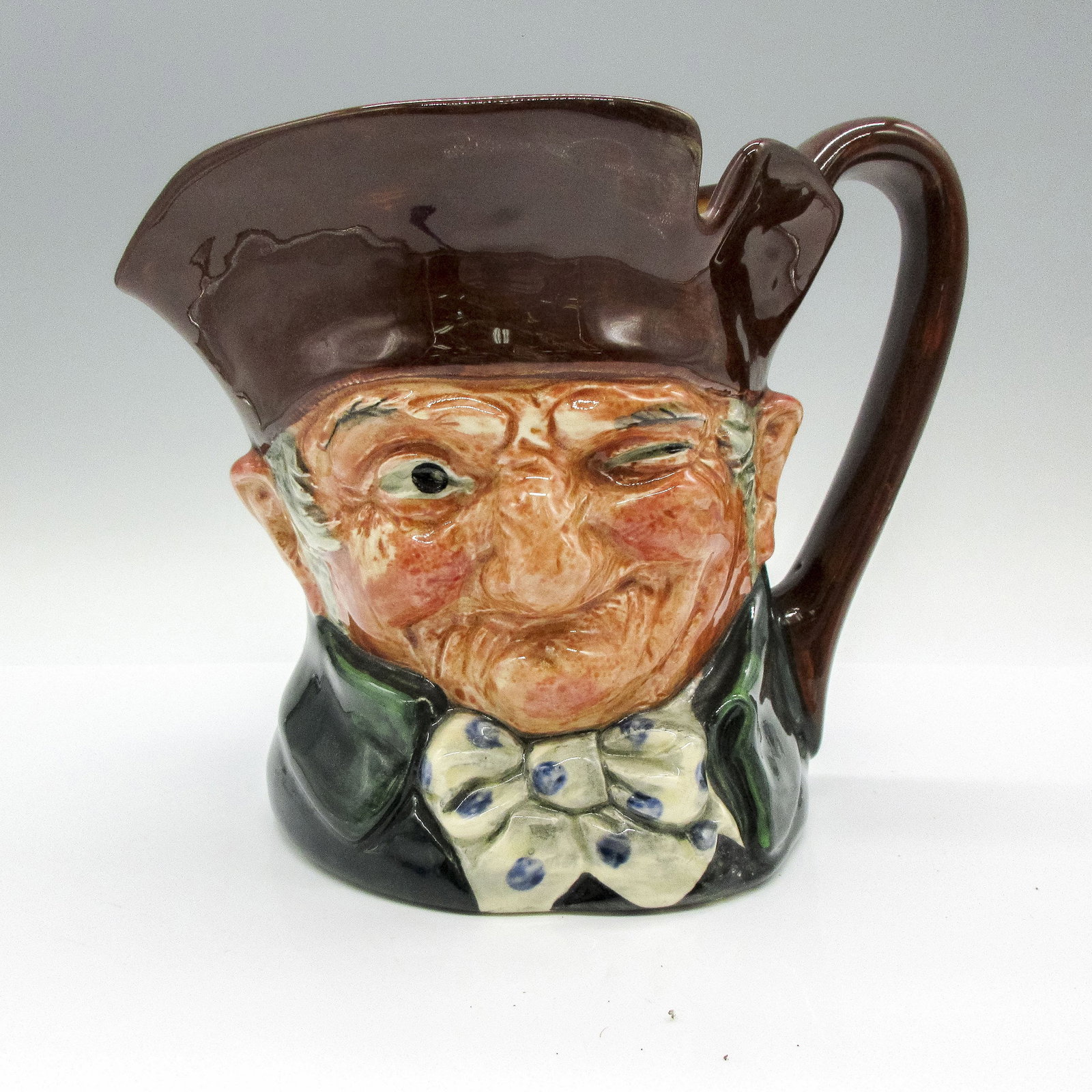 Old Charley D5420 - Large - Royal Doulton Character Jug: Brown hat, dark green coat, blue polka-dot bow tie. Royal Doulton backstamp. Artist: Charles J. Noke Dimensions: 5.5"H Date or Era: 1934 - 1983 Manufacturer or Brand: Royal Doulton Country of Orig
